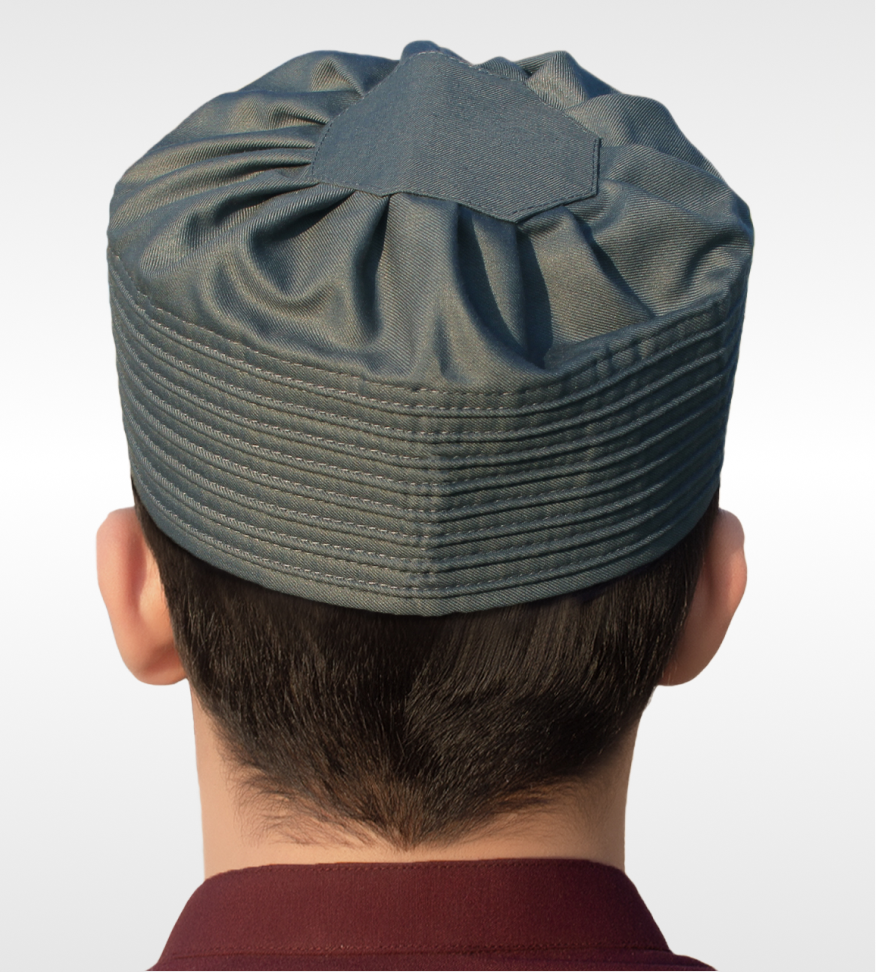 Dark Gray Ribbed Kufi, emphasizing its soft structure and size stability.