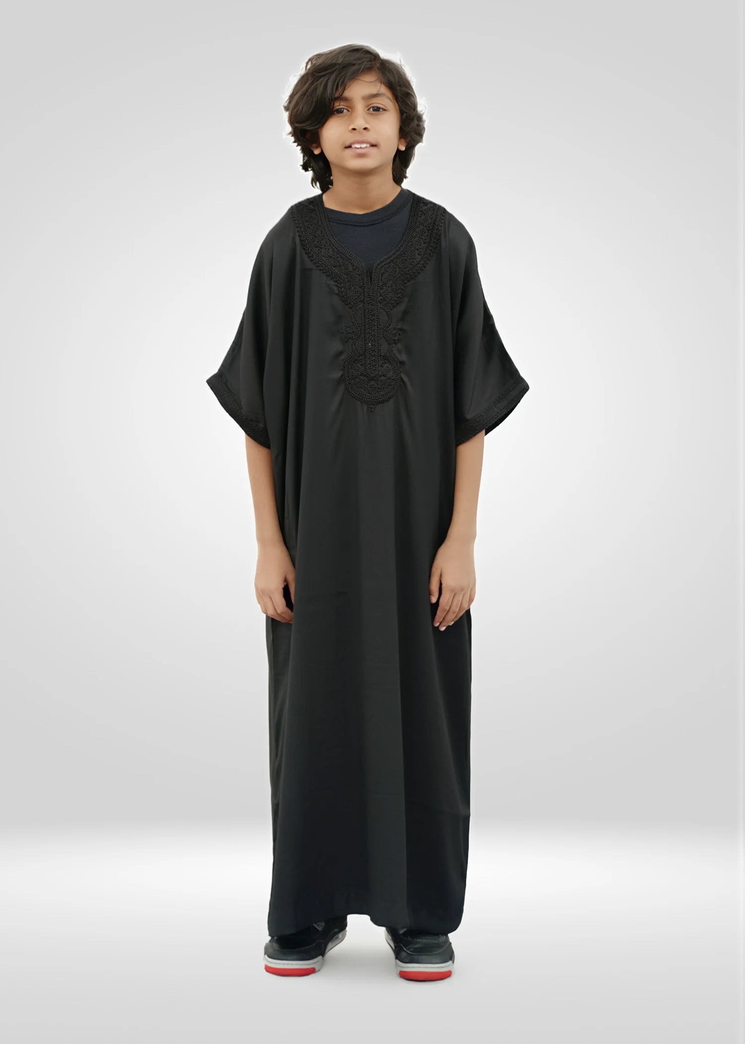 Front view of the Black Moroccan Kids Thobe showing the relaxed gandora fit and short sleeves