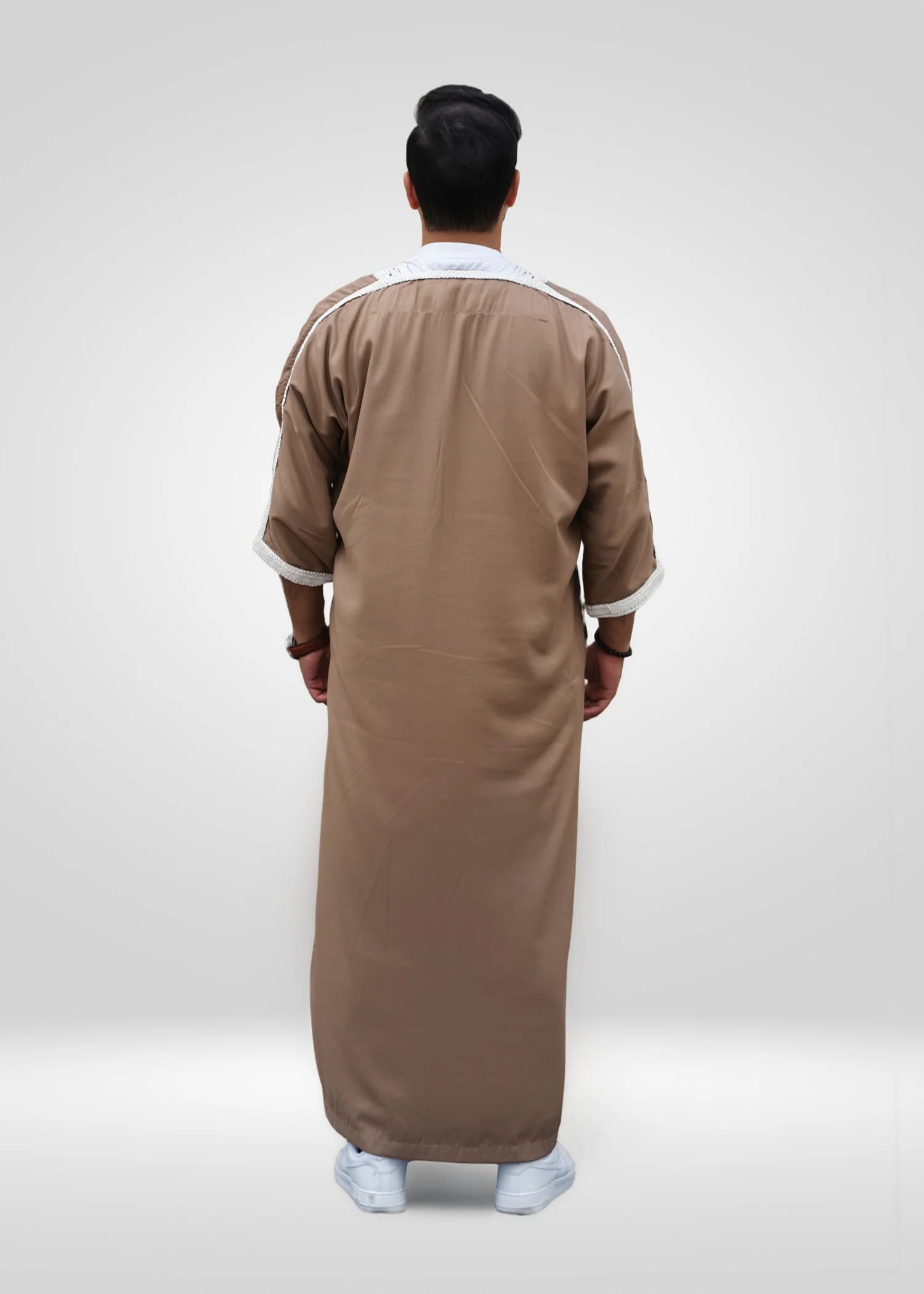 Flat lay image of the folded Beige & White Moroccan Thobe showing the premium embroidery contrast