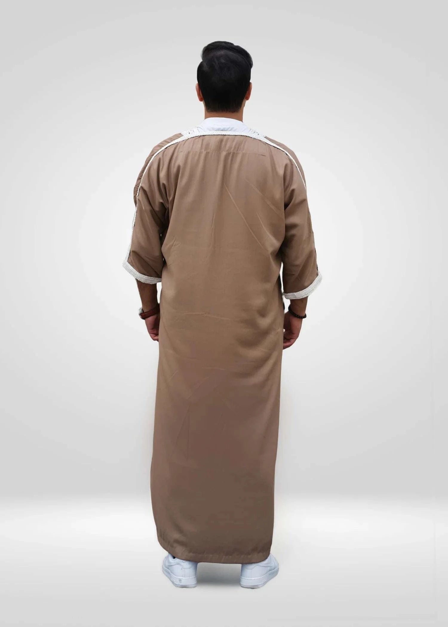 Flat lay image of the folded Beige & White Moroccan Thobe showing the premium embroidery contrast