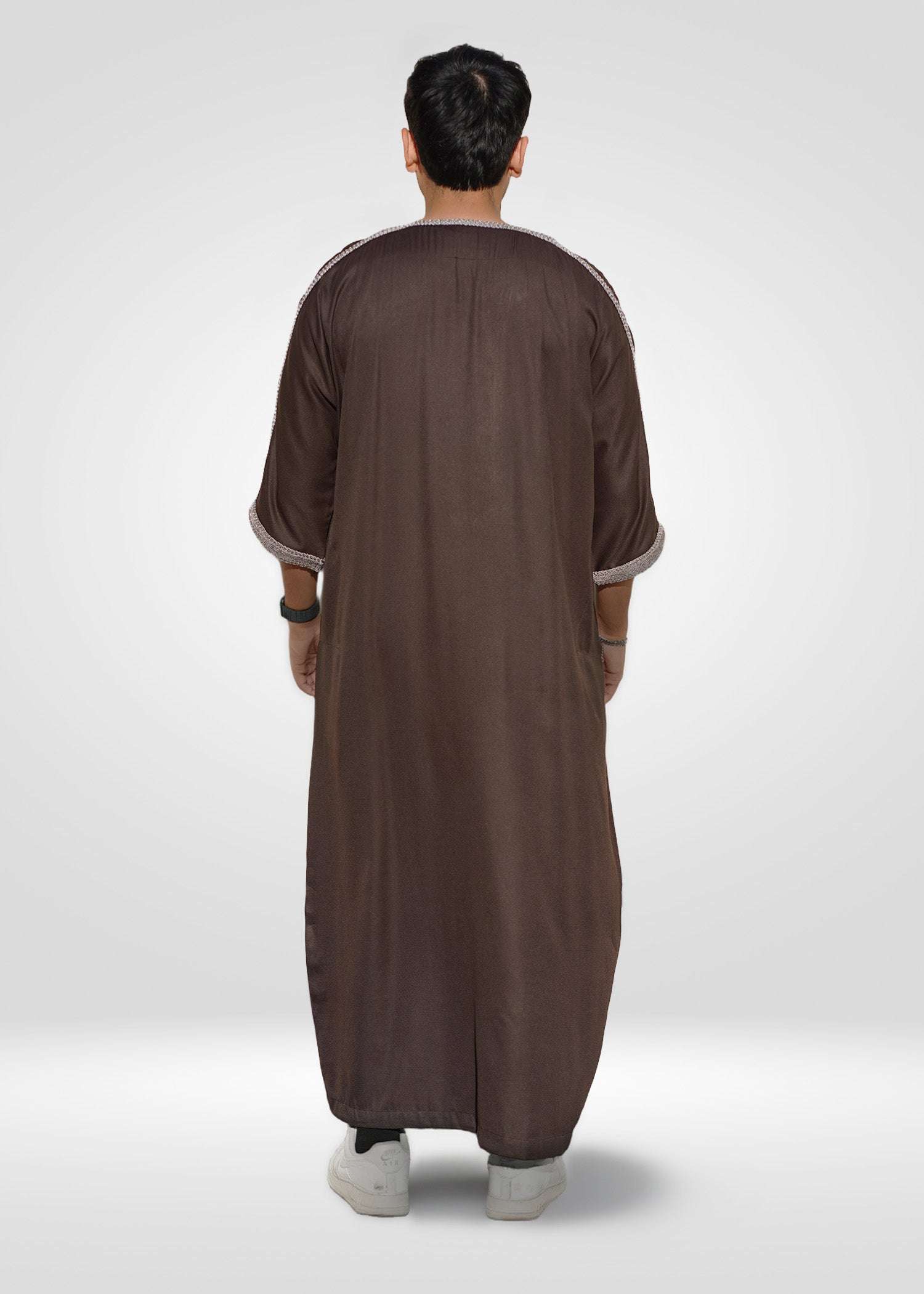 Flat lay image of the folded Espresso Beans Moroccan Thobe showing the premium embroidery contrast