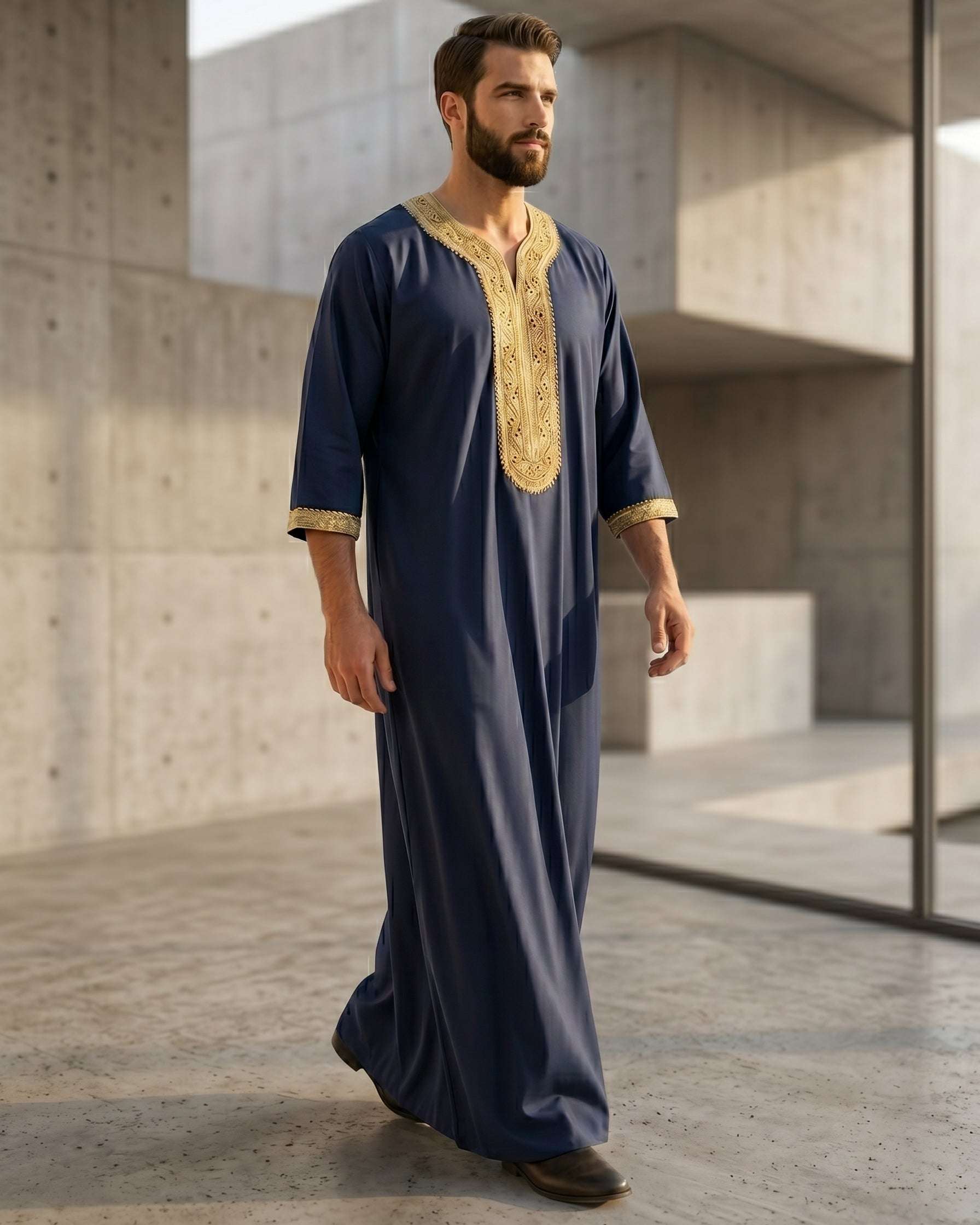 Authentic Moroccan style men's gandora in navy blue and gold, luxury Islamic menswear, modest apparel for Muslims, traditional Middle Eastern clothing, premium three quarter sleeve thobe, best Eid clothing for men.