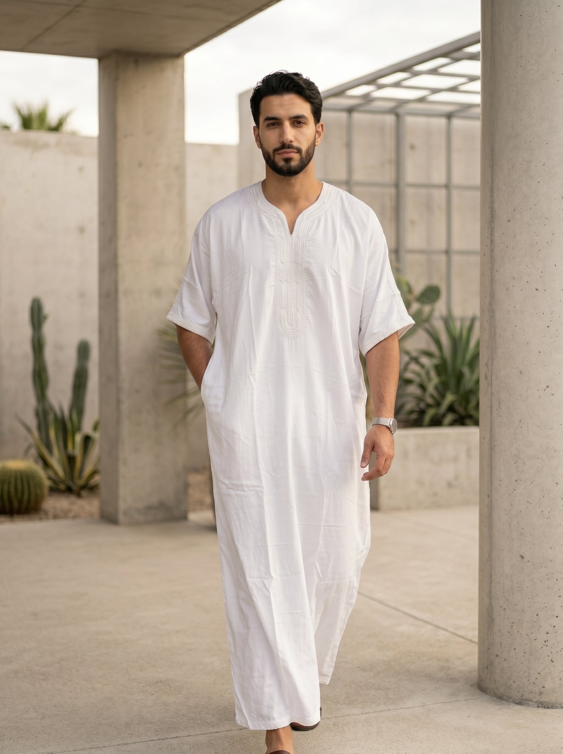Authentic Moroccan style men's gandora in solid white, luxury Islamic menswear, modest apparel for Muslims, traditional Middle Eastern clothing, premium half sleeve thobe, best Eid clothing for men, modern modest wardrobe essentials.