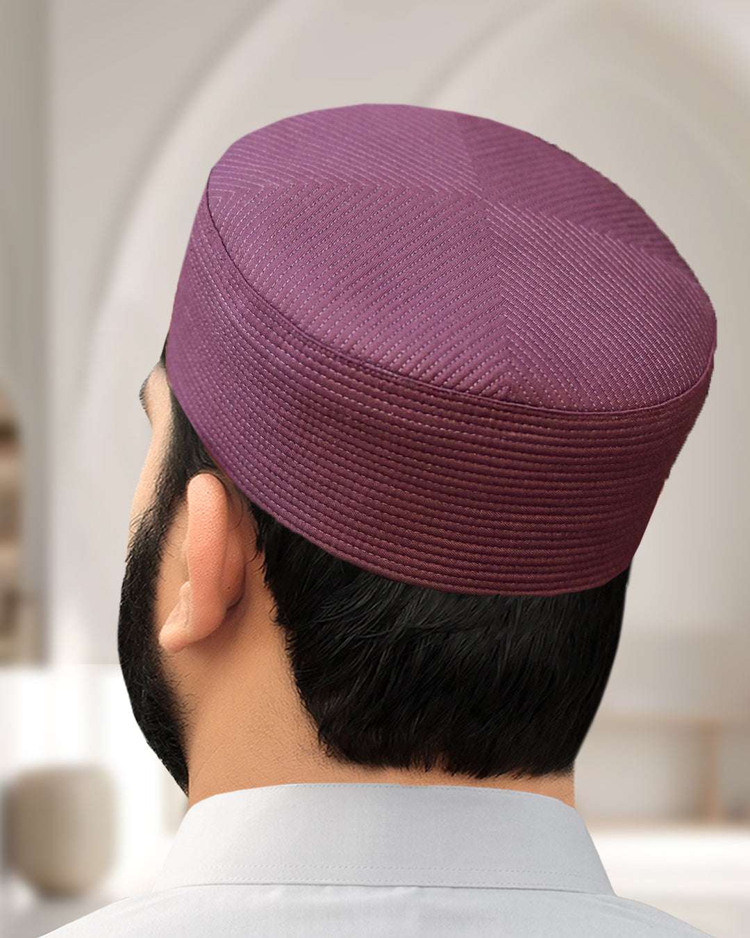 Maroon structured kufi prayer cap for men, shown from the side