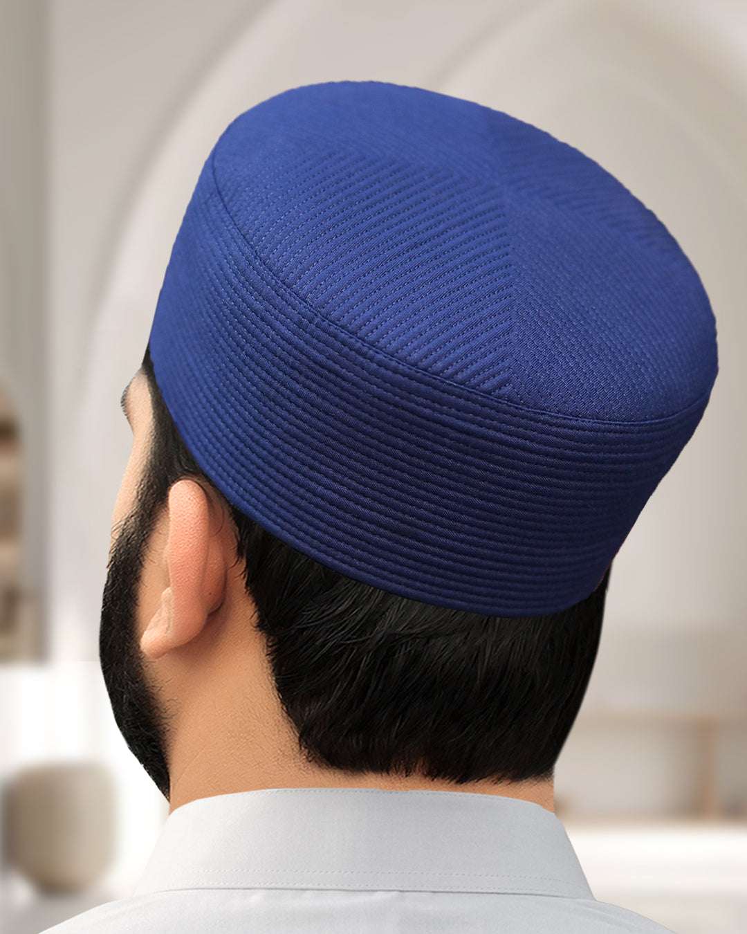 Navy blue structured kufi prayer cap for men, seen from above