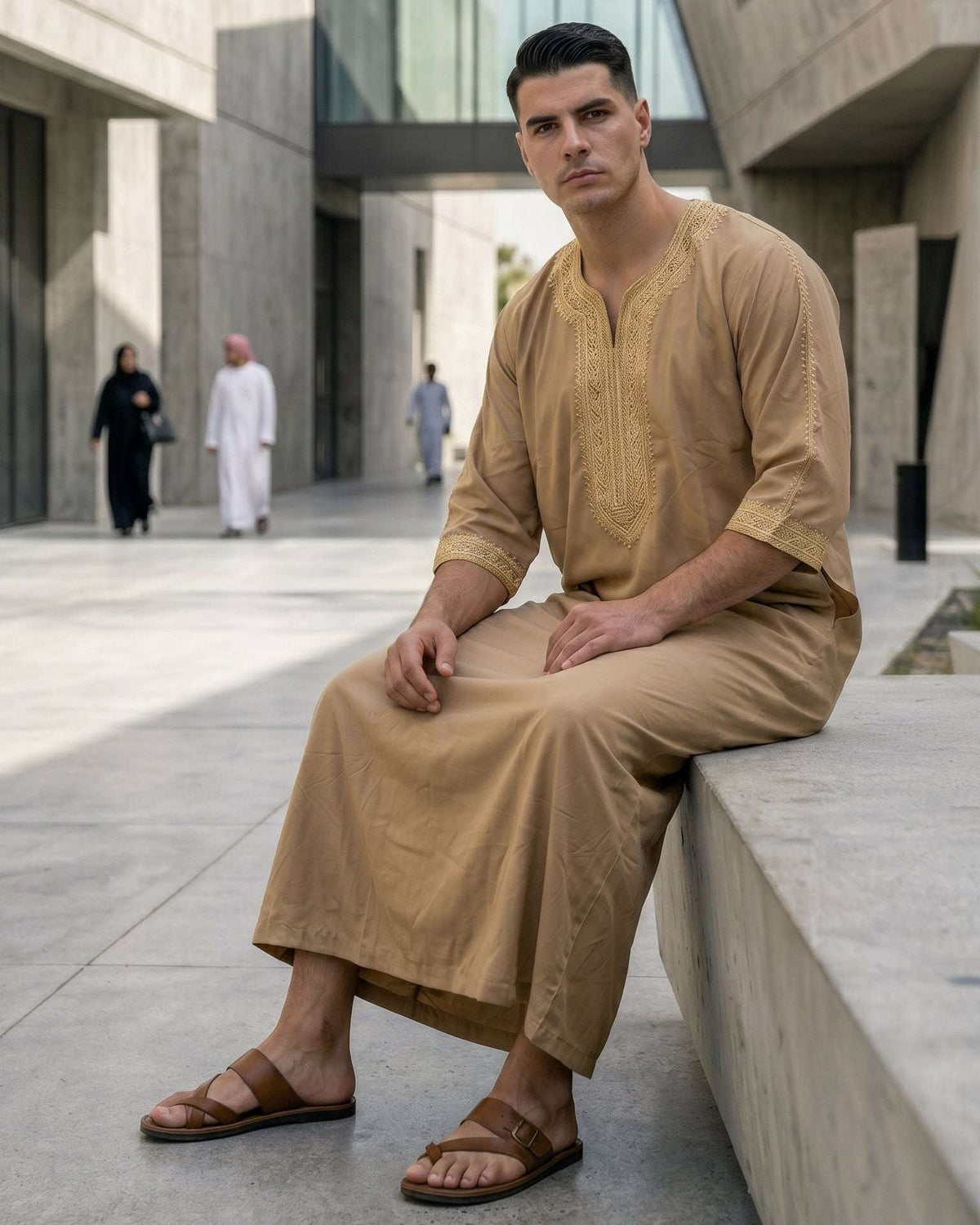 Beige Moroccan thobe with gold embroidery for men, close-up of the fabric