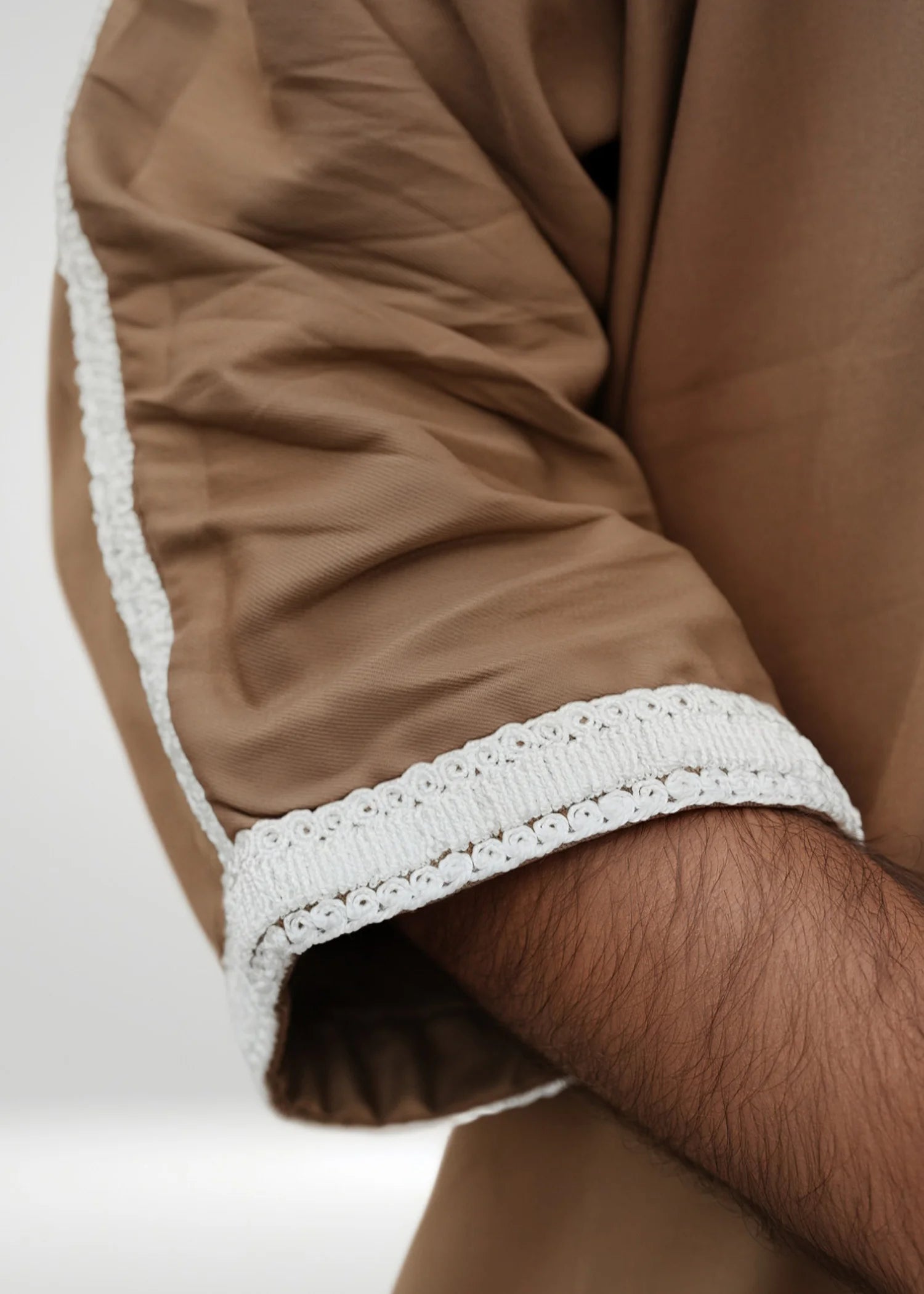 Back view of the Beige & White Moroccan Thobe highlighting the clean silhouette and soft fabric