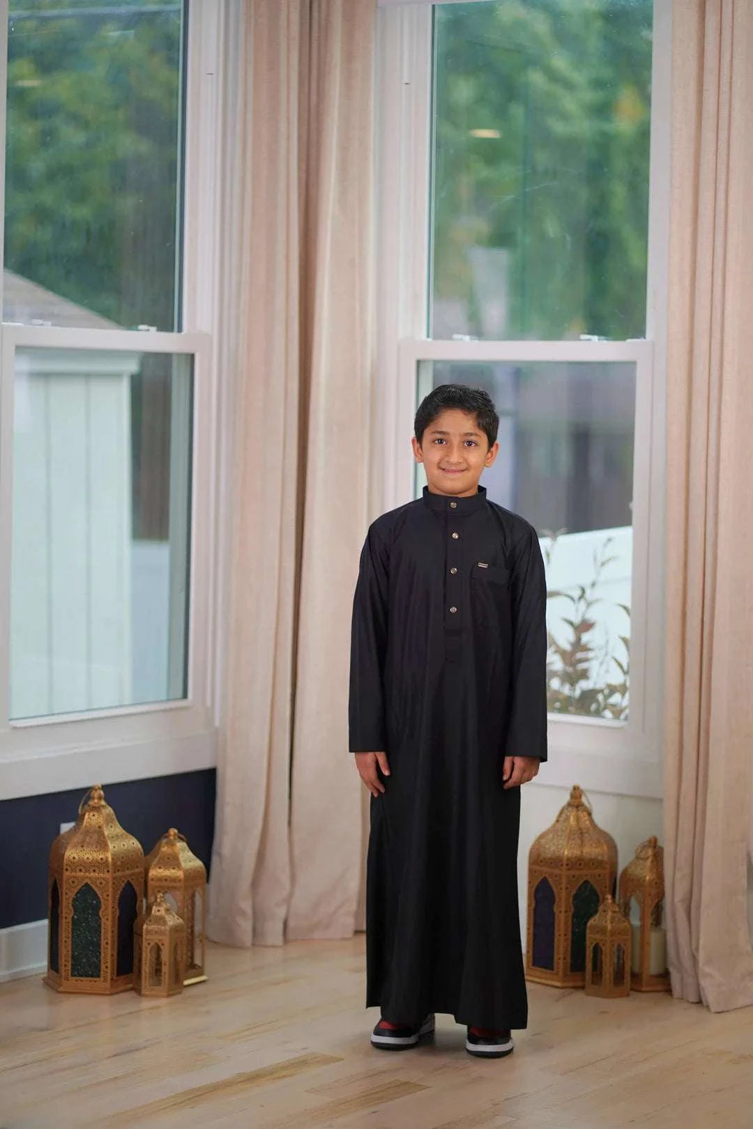 Black thobe for boys, close-up of the embroidered detailing