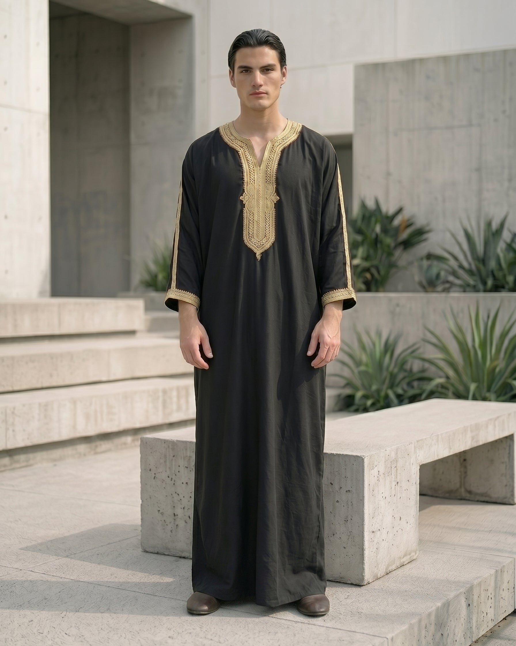 Elegant black men's thobe with gold traditional embroidery, premium modest fashion, comfortable Friday prayer clothes, stylish Muslim men's apparel, high-quality Moroccan jubbah, designer Islamic garments, affordable Sunnah clothing.