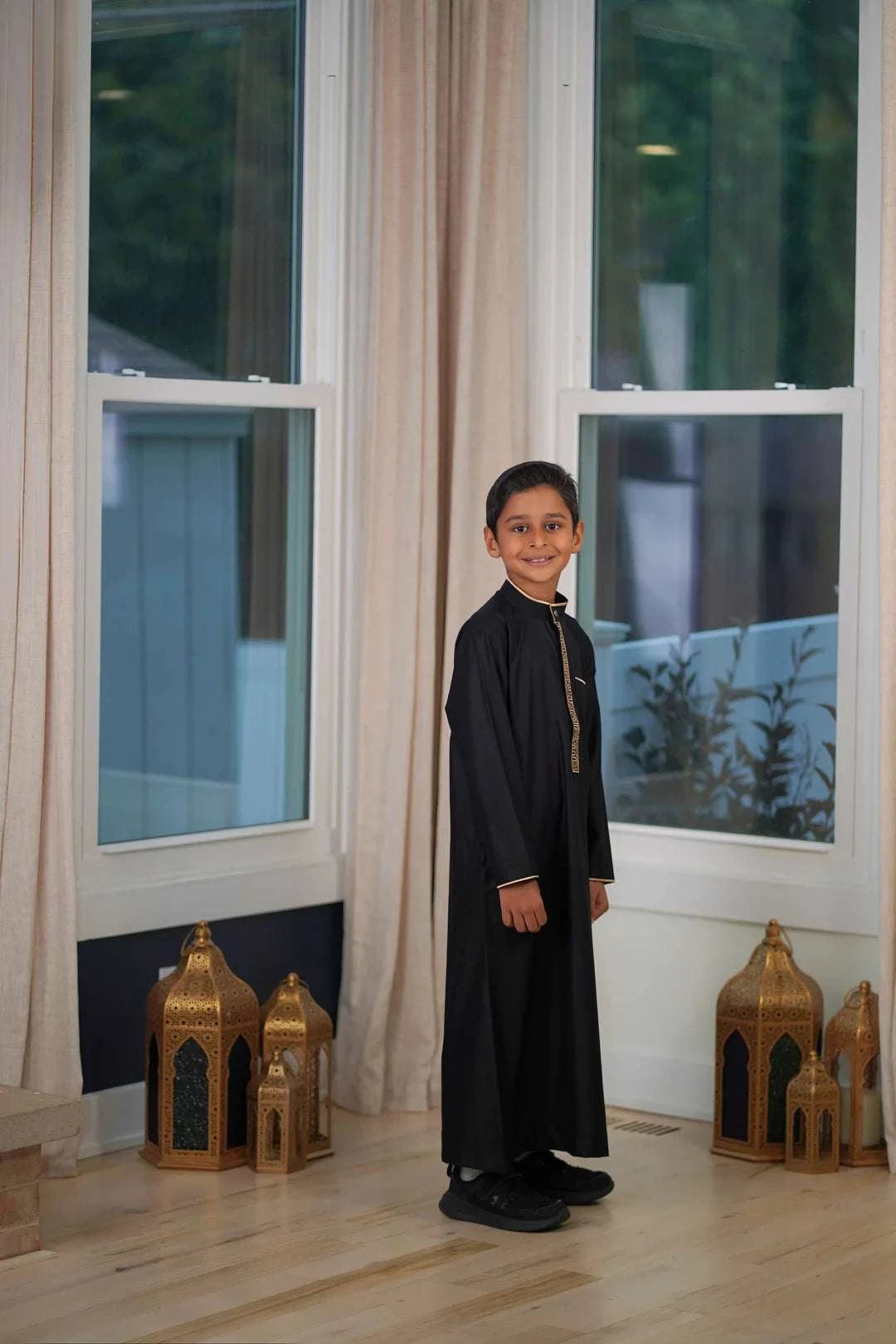 Black and gold embroidered thobe with mandarin collar for boys, embroidery in close detail