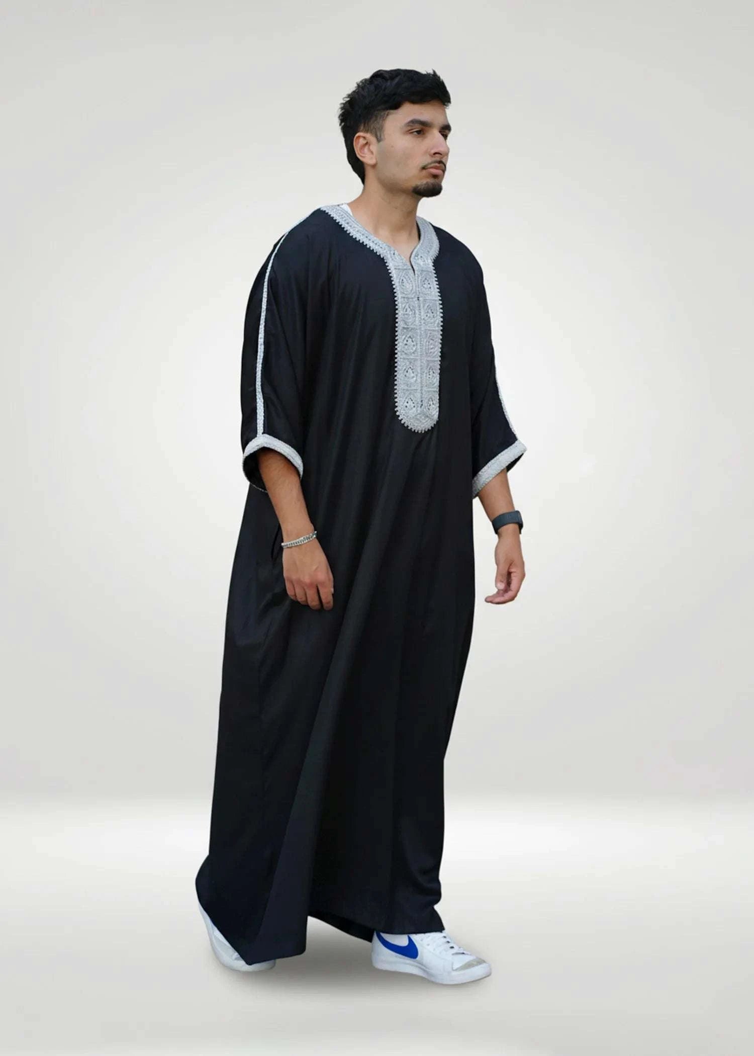Side view of the black gandora showing the loose sleeves and comfortable drape