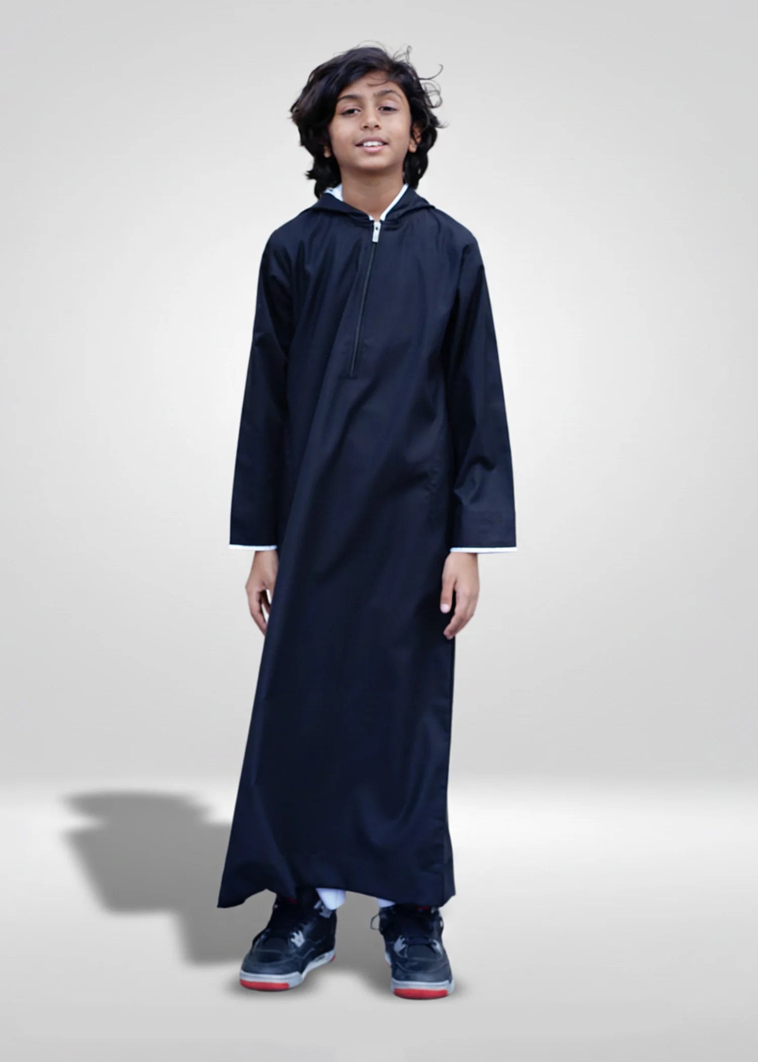 Front view of the Black Hoodie Kids Thobe showing the sleek design and white piping details