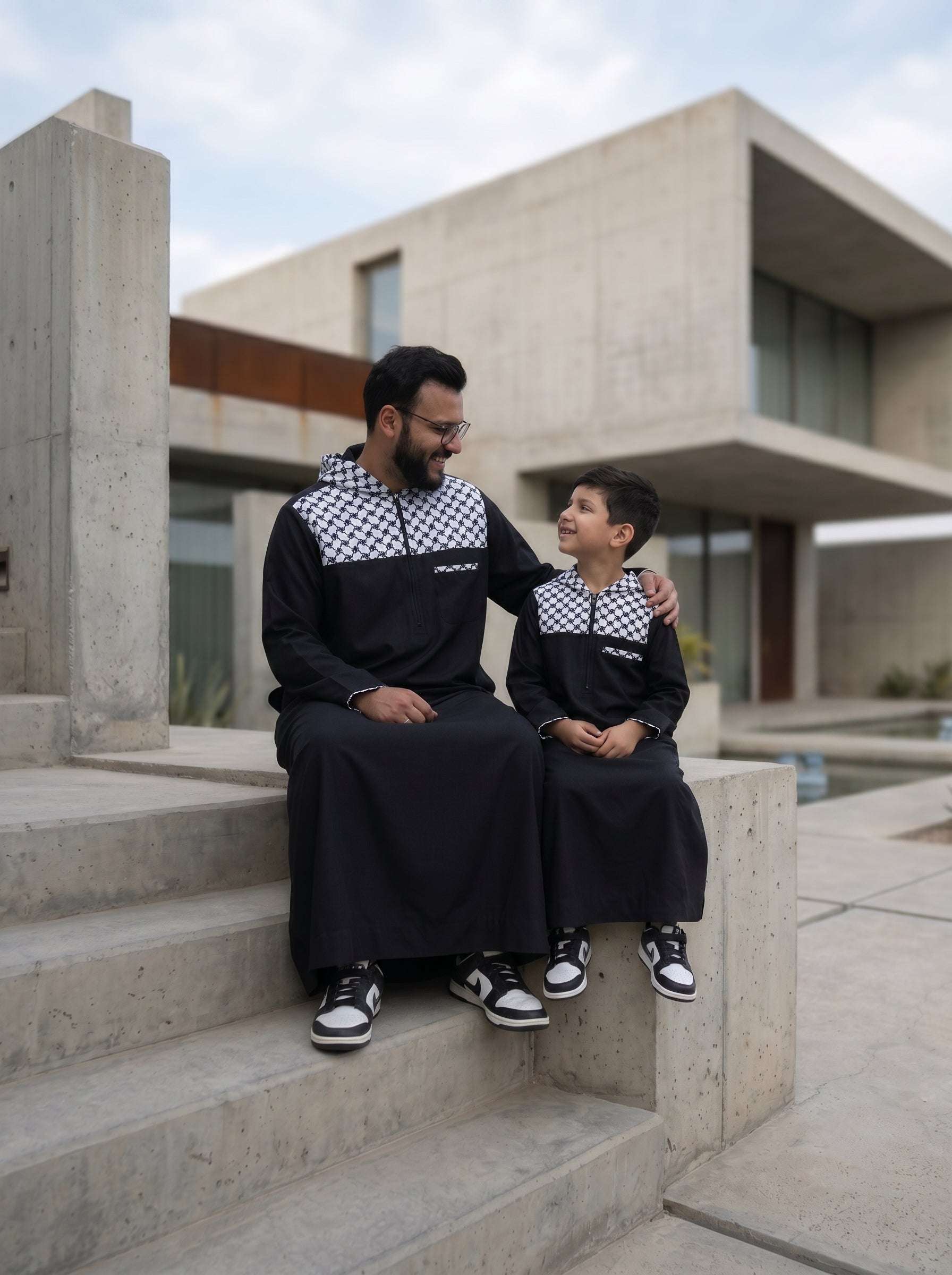 Black Palestine hoodie thobe for men and boys, showing the length and sleeve line