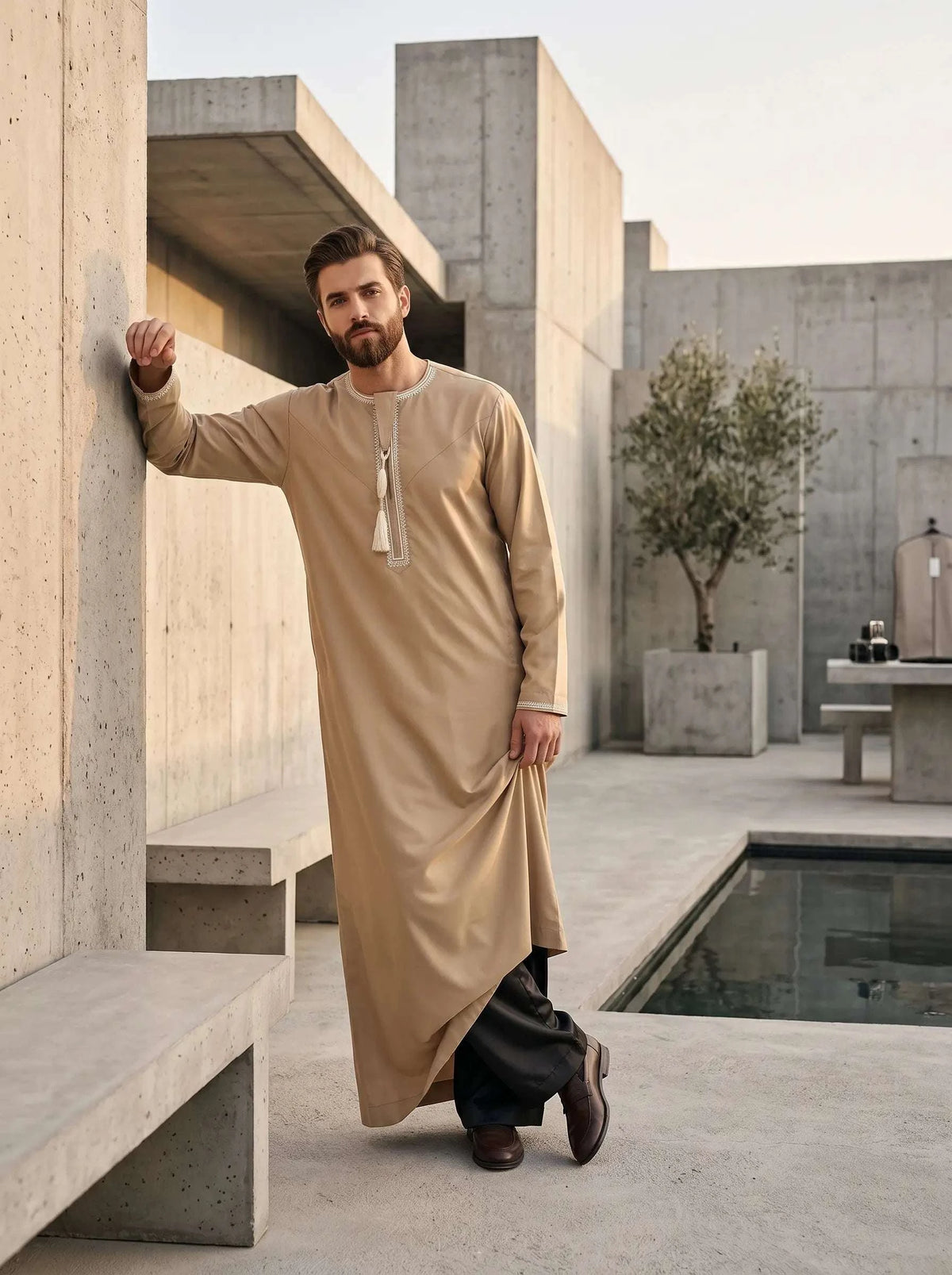 Black thobe trouser for men, worn by a model outdoors