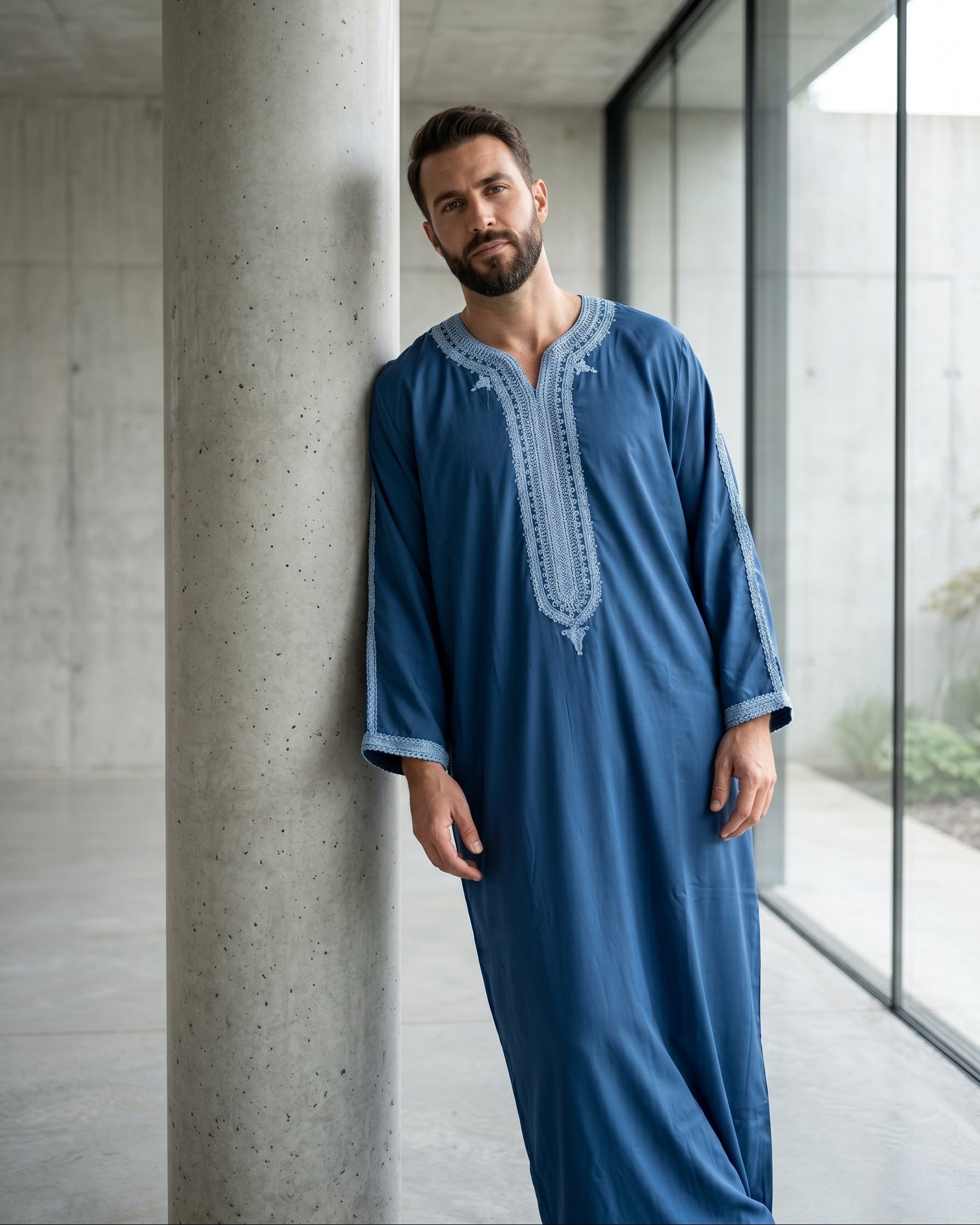 Elegant blue men's thobe with traditional embroidery, premium modest fashion, comfortable Friday prayer clothes, stylish Muslim men's apparel, high-quality Moroccan jubbah, designer Islamic garments, affordable Sunnah clothing.