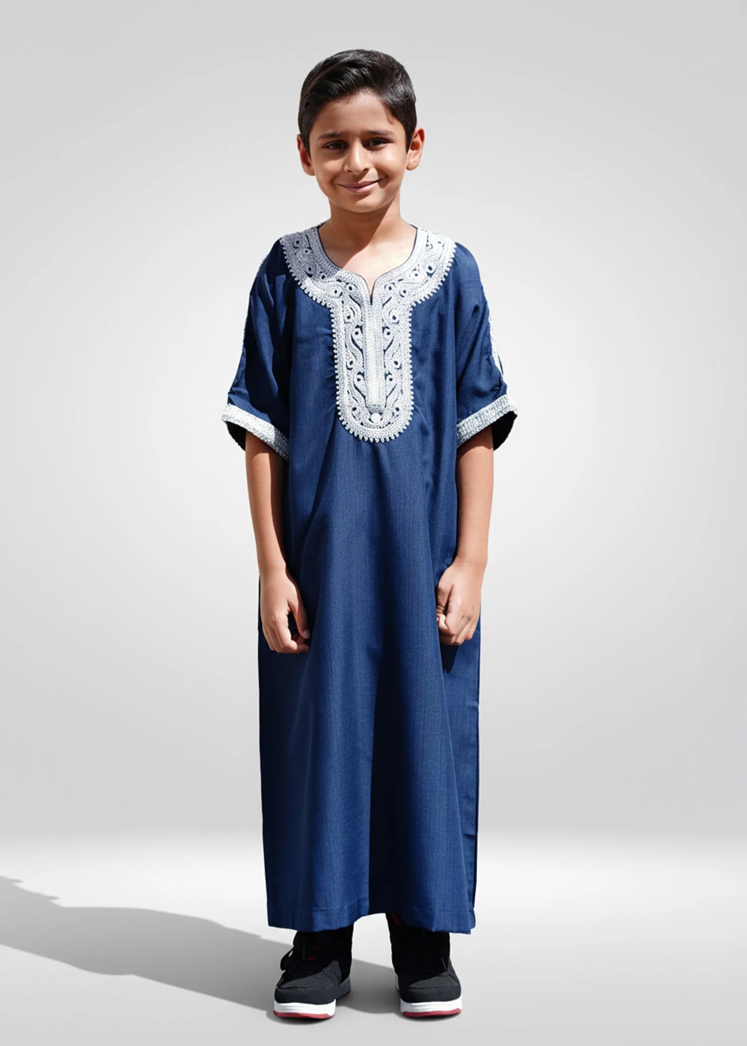 Front view of the Blue/Silver Moroccan Kids Thobe showing the royal blue fabric and silver embroidery