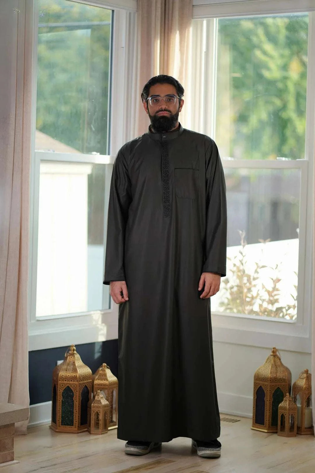 Charcoal black embroidered thobe with mandarin collar for men, embroidery shown in close detail