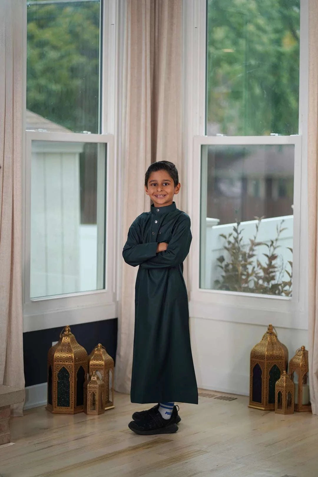 Dark green thobe for boys, fabric weave in close detail
