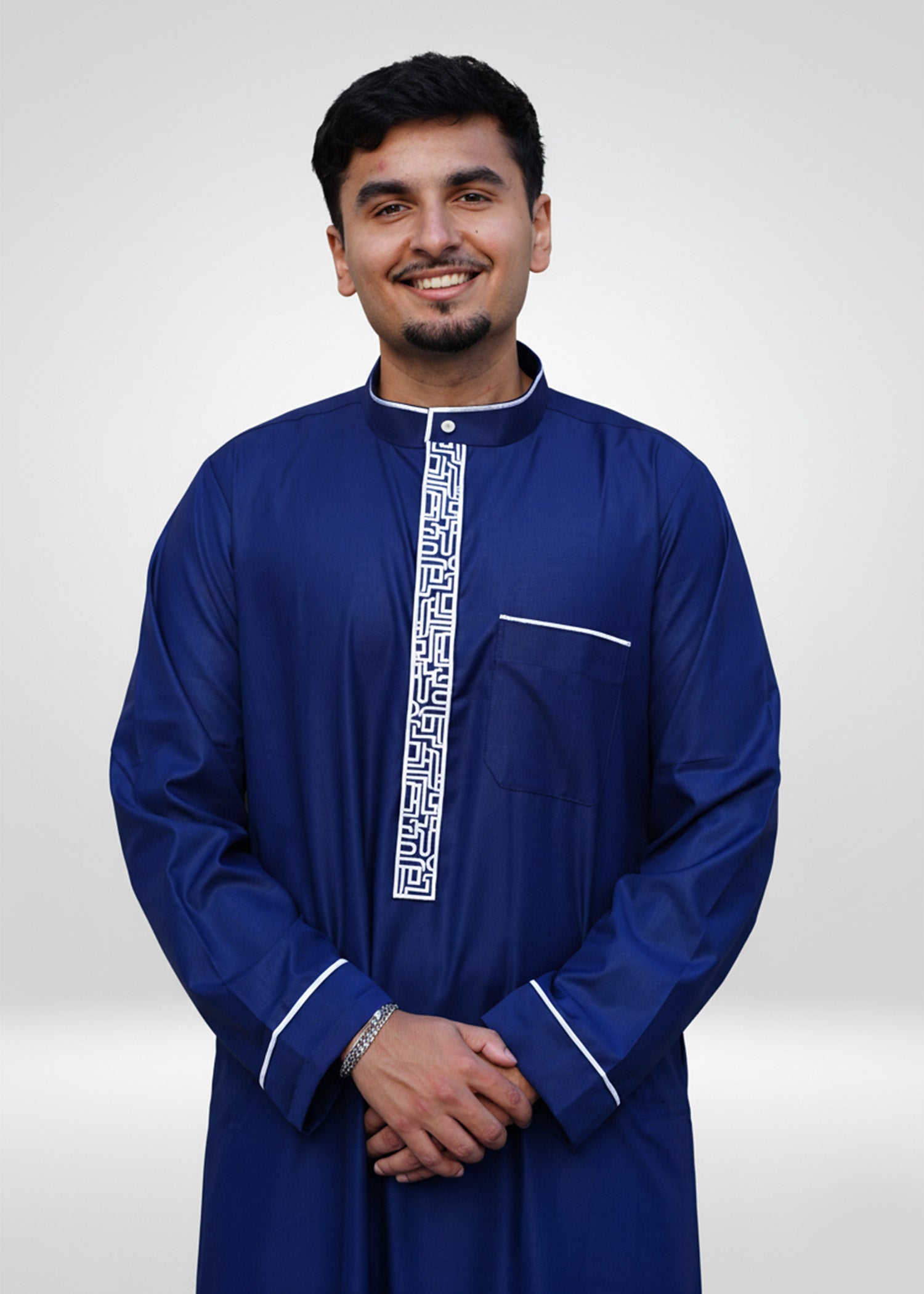 Side profile view of the men's royal blue thobe showing the structured formal fit