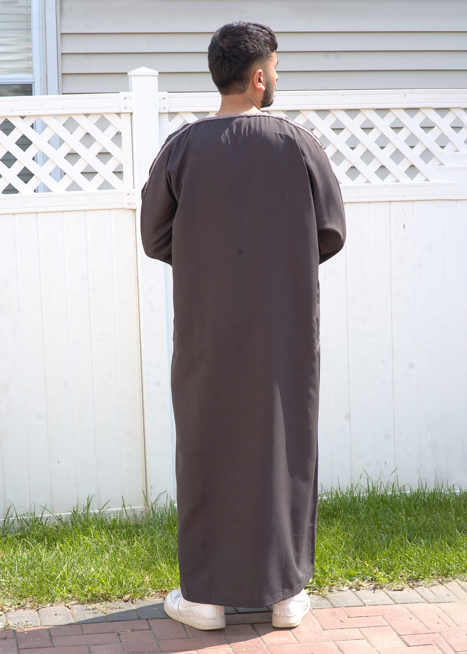 Extreme close-up of the breathable fabric texture in the deep charcoal gray color.