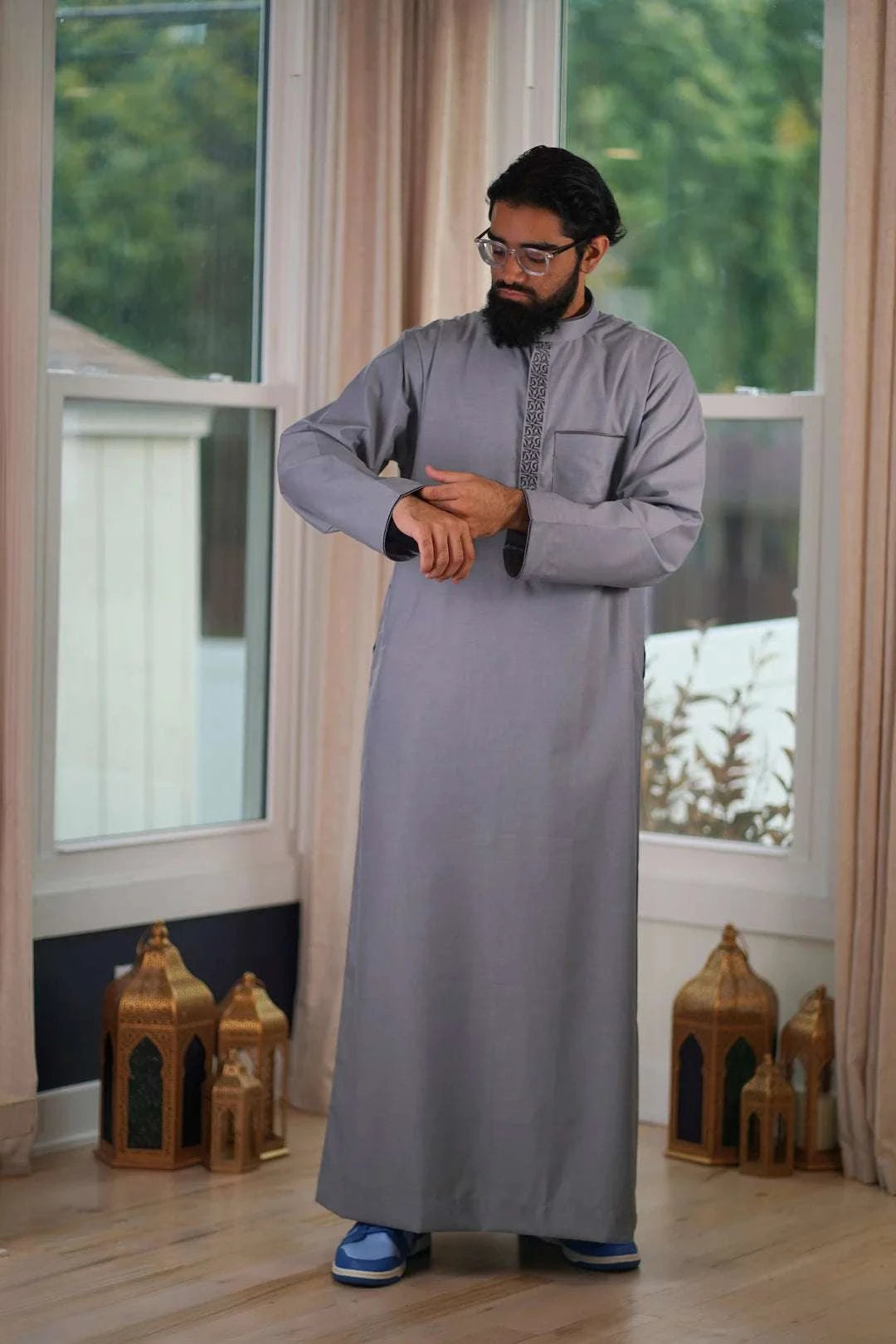 Gray embroidered thobe with mandarin collar for men, embroidery shown in close detail
