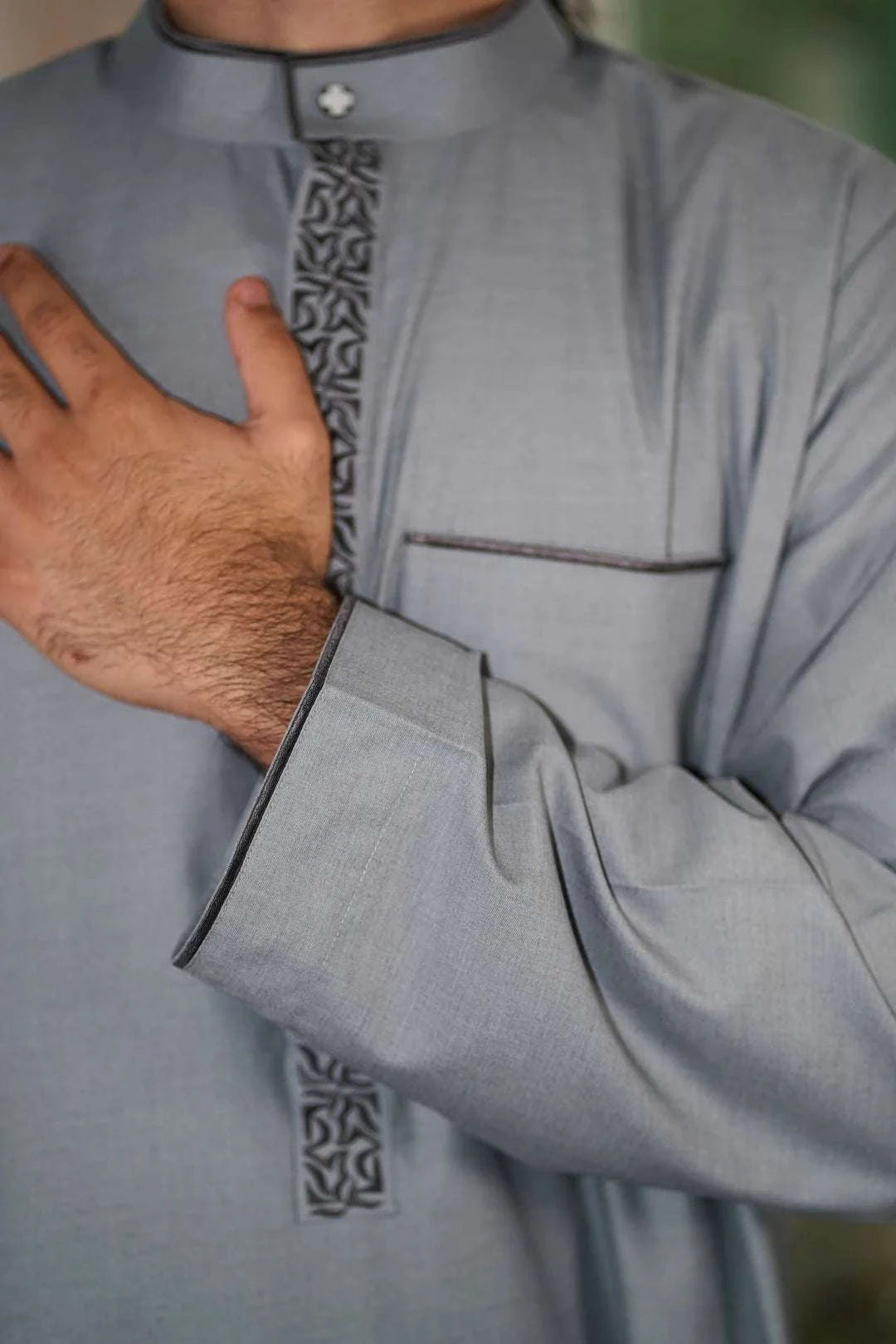 Gray embroidered thobe with mandarin collar for men, buttoned placket in close detail