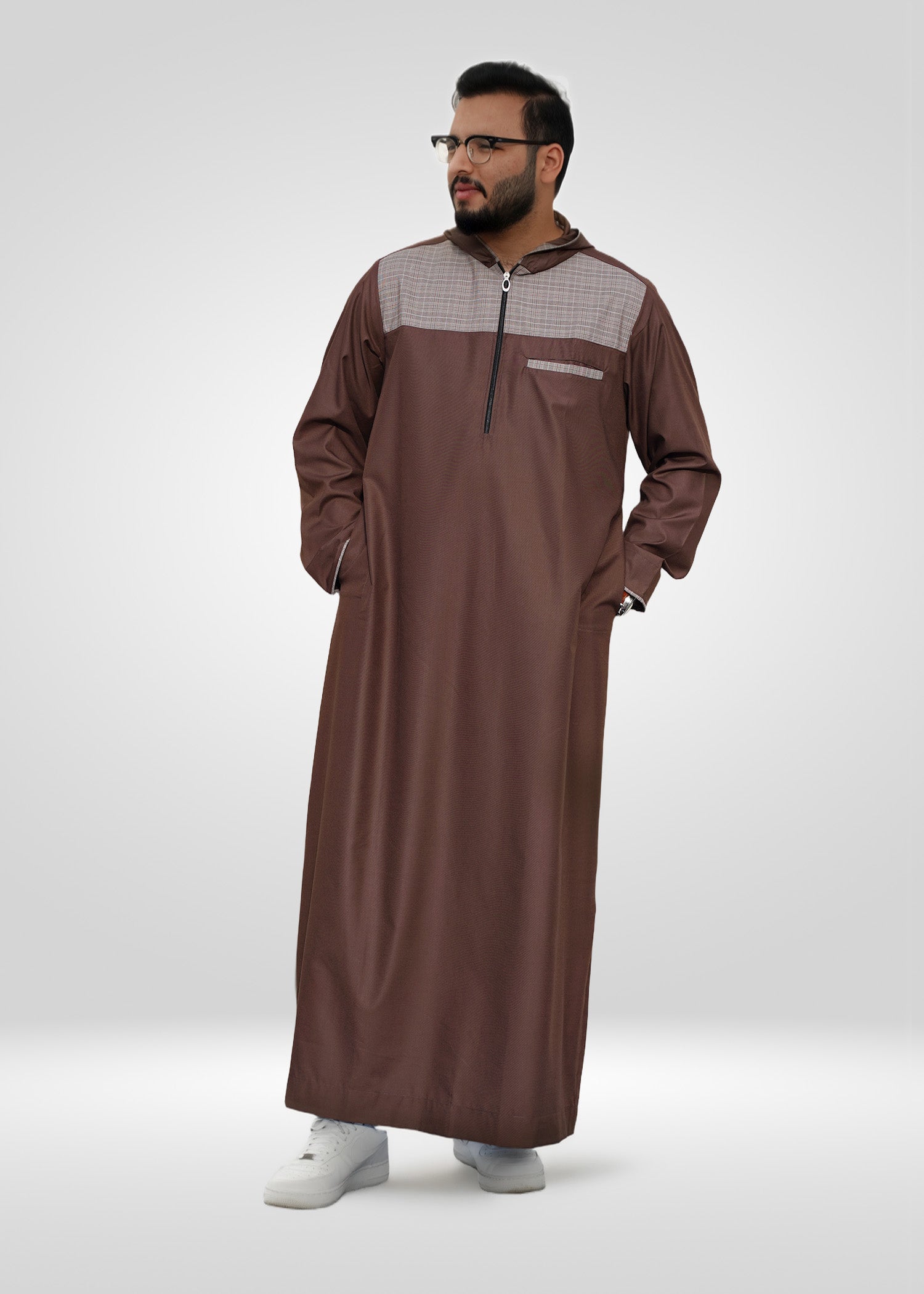 Close up of the stylish beige and brown plaid design on the chest of the men's jubba