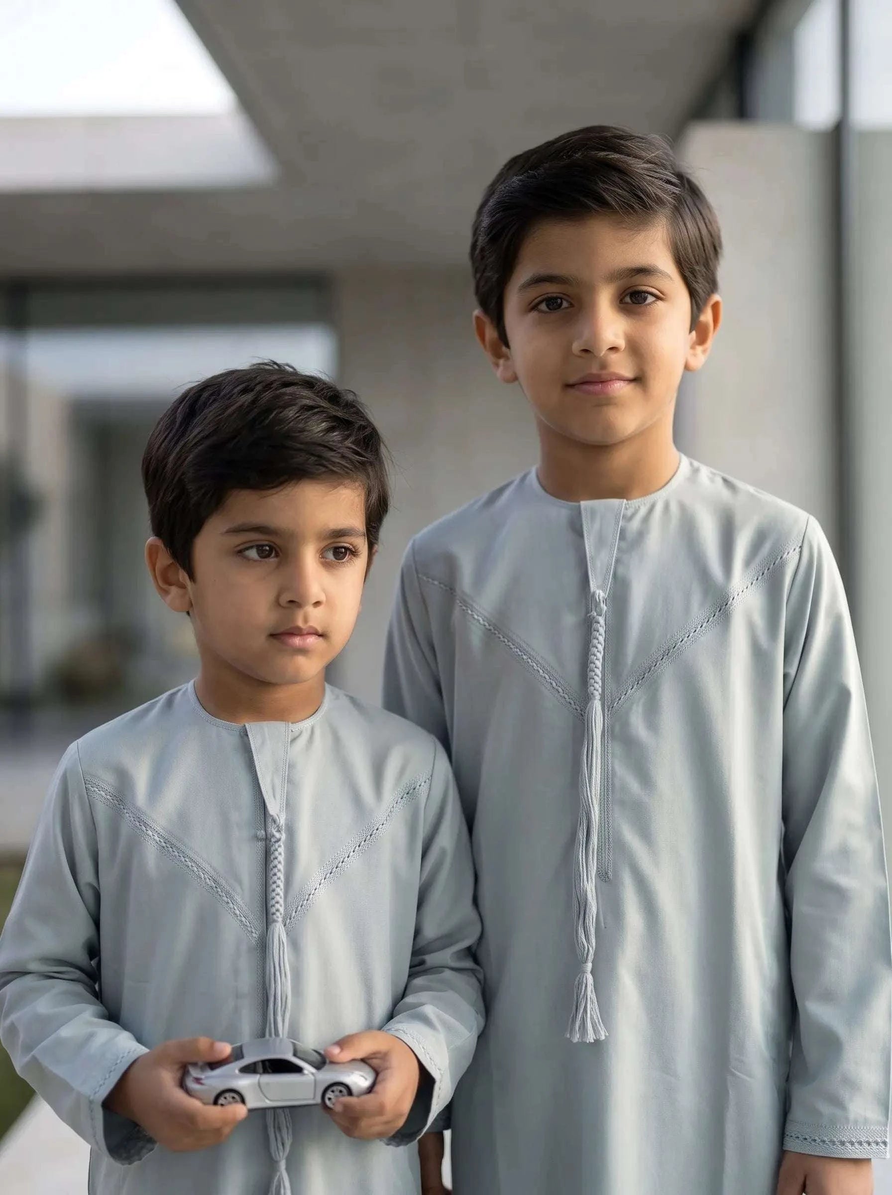 Ice blue Emirati thobe for boys, close-up of the fabric