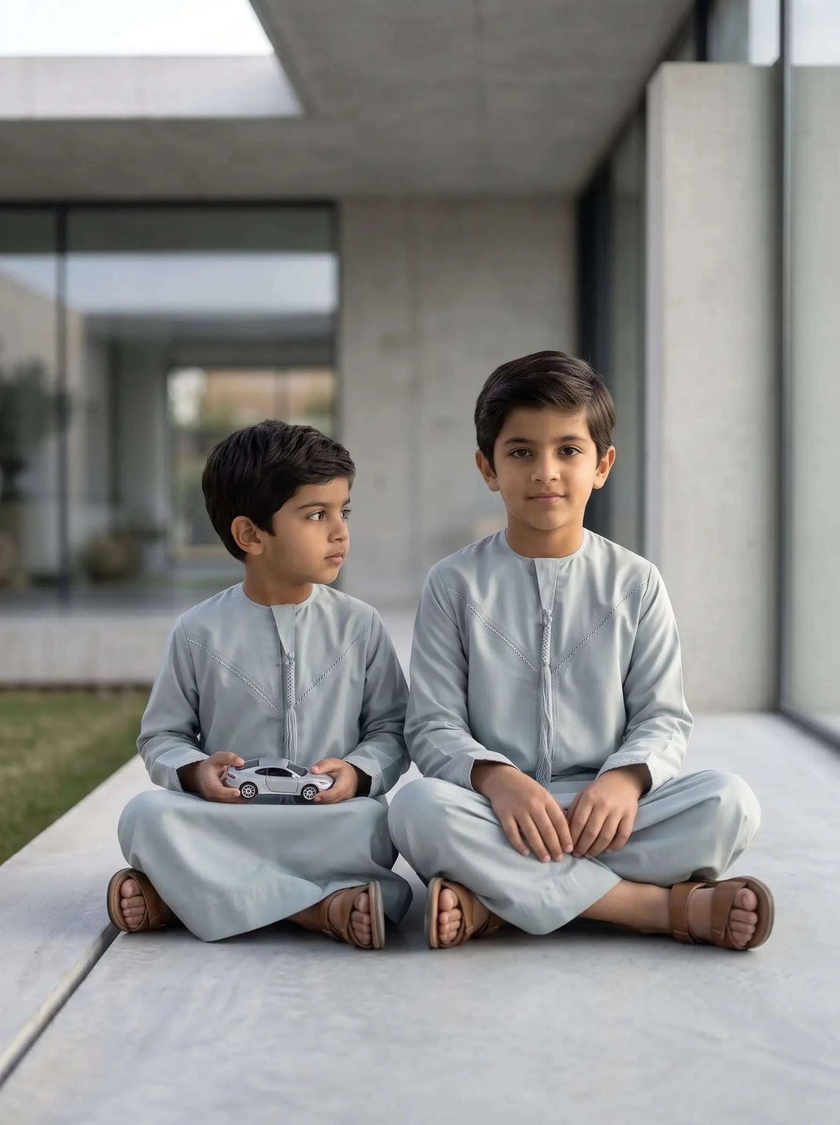 Ice blue Emirati kandura for boys, side profile view