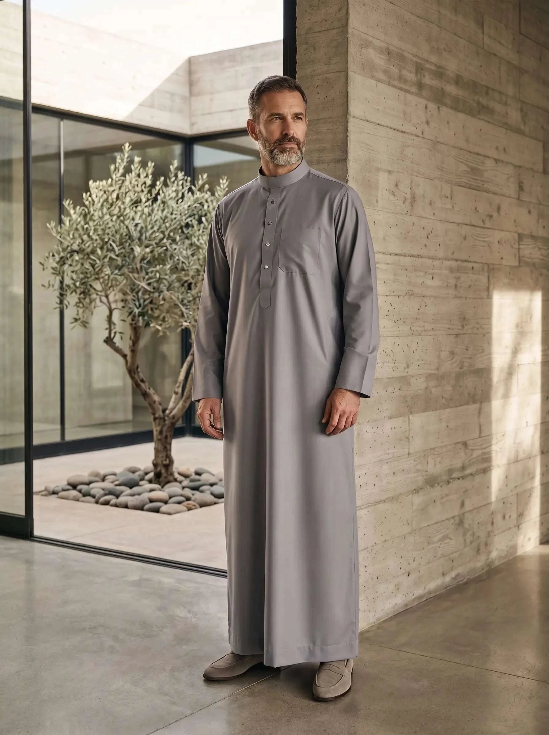Light grey minimalist thobe for men, close-up of the collar and buttons