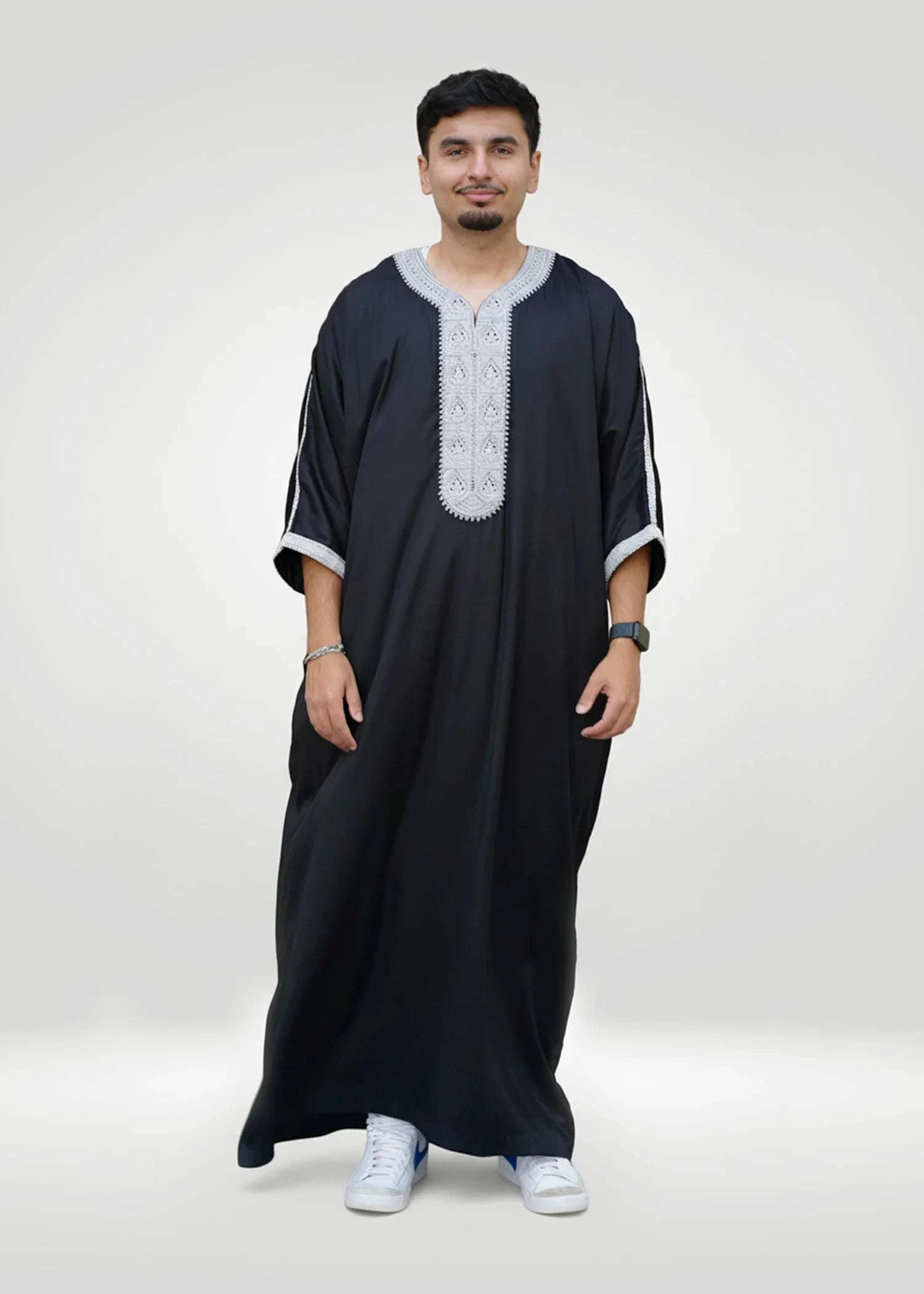 Lifestyle shot of a man wearing the black and silver gandora, looking confident and stylish