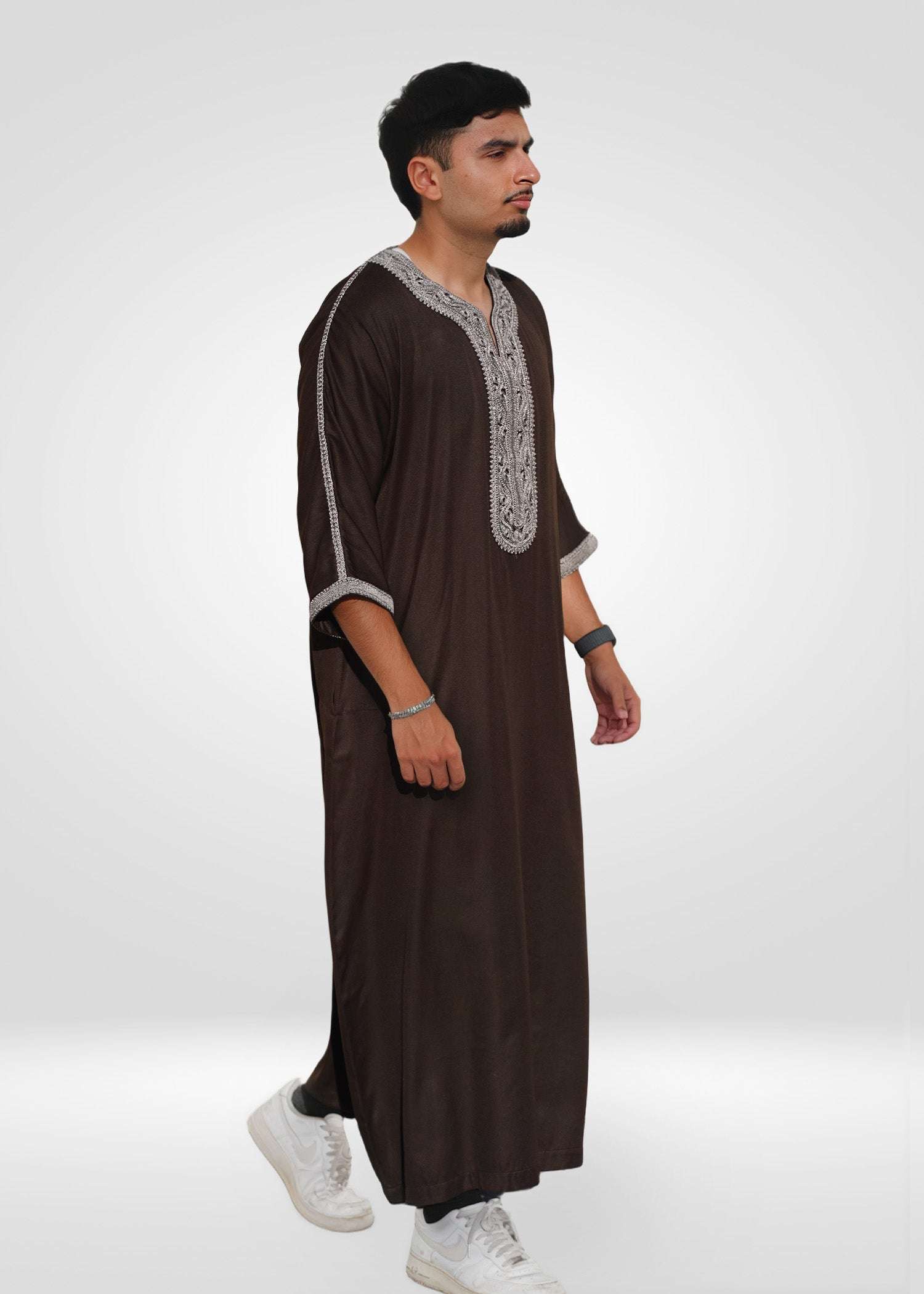 Lifestyle shot of a man wearing the espresso brown gandora, looking relaxed and stylish