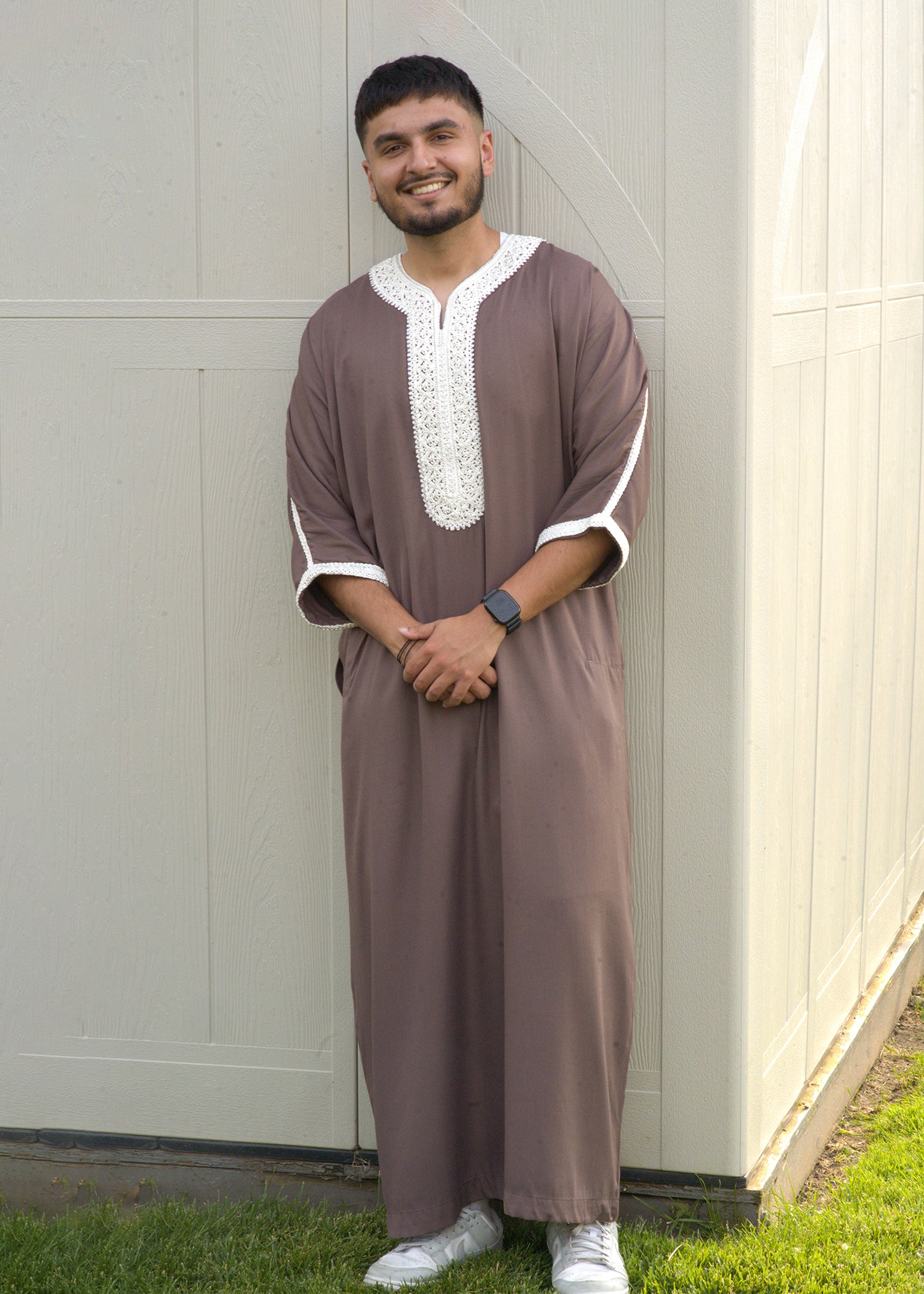 Full body view of Islamic men's wear in a unique color, highlighting Moroccan embroidery and modest fashion.