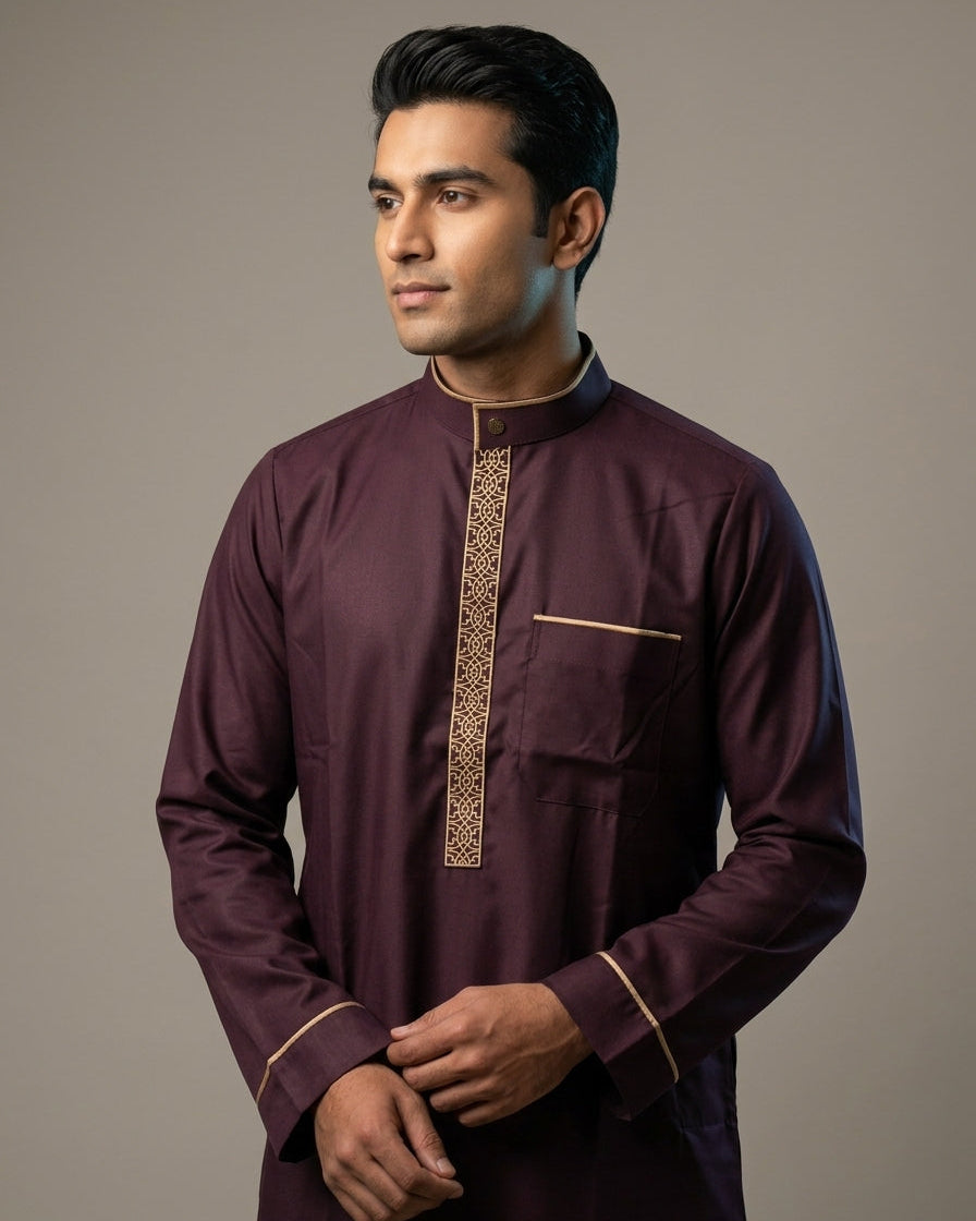 Formal maroon jubbah for men standing, traditional Islamic clothing with modern bronze details, modest menswear, comfortable Sunnah attire, affordable premium thobe.