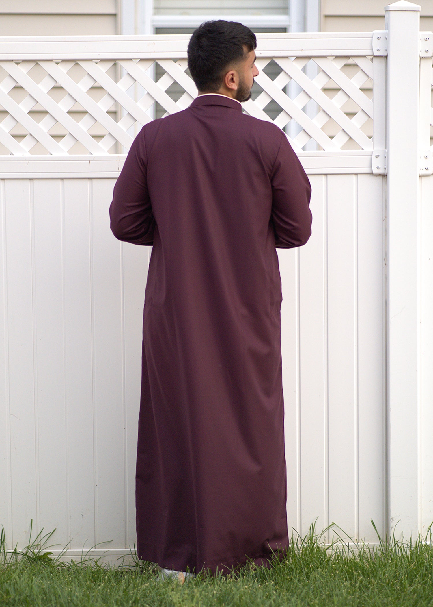 Side profile view of the men's maroon thobe showing the structured formal fit