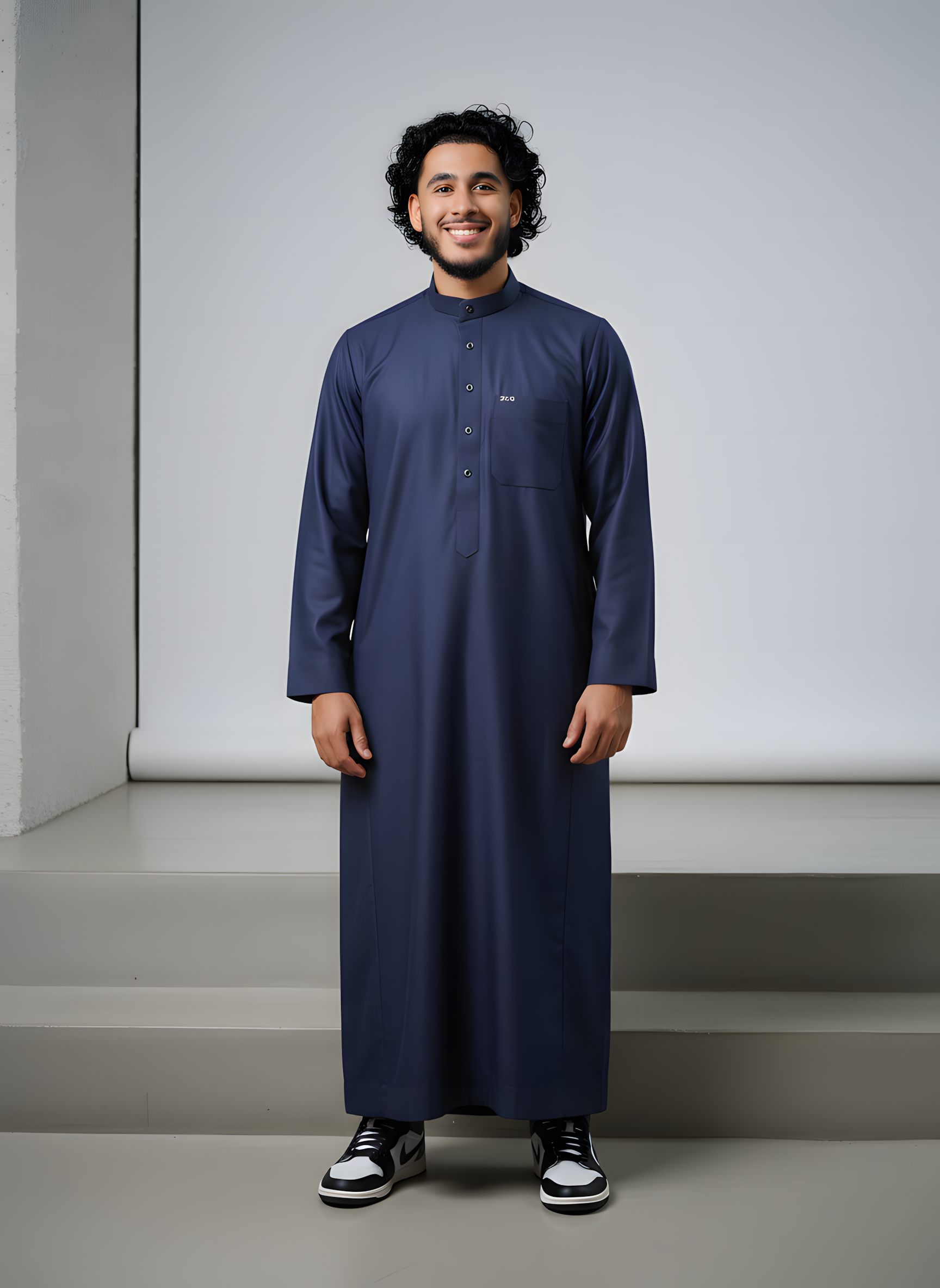 Little boy modeling a stylish brown Moroccan thobe with intricate chest embroidery, ideal for Eid and special occasions.