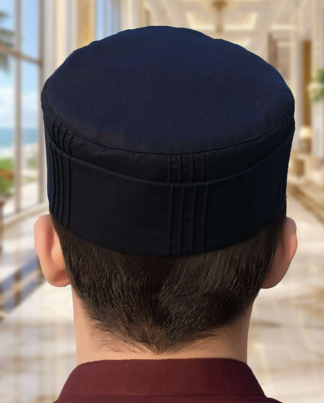 Navy blue pleated structured kufi prayer cap for men, shown from the front