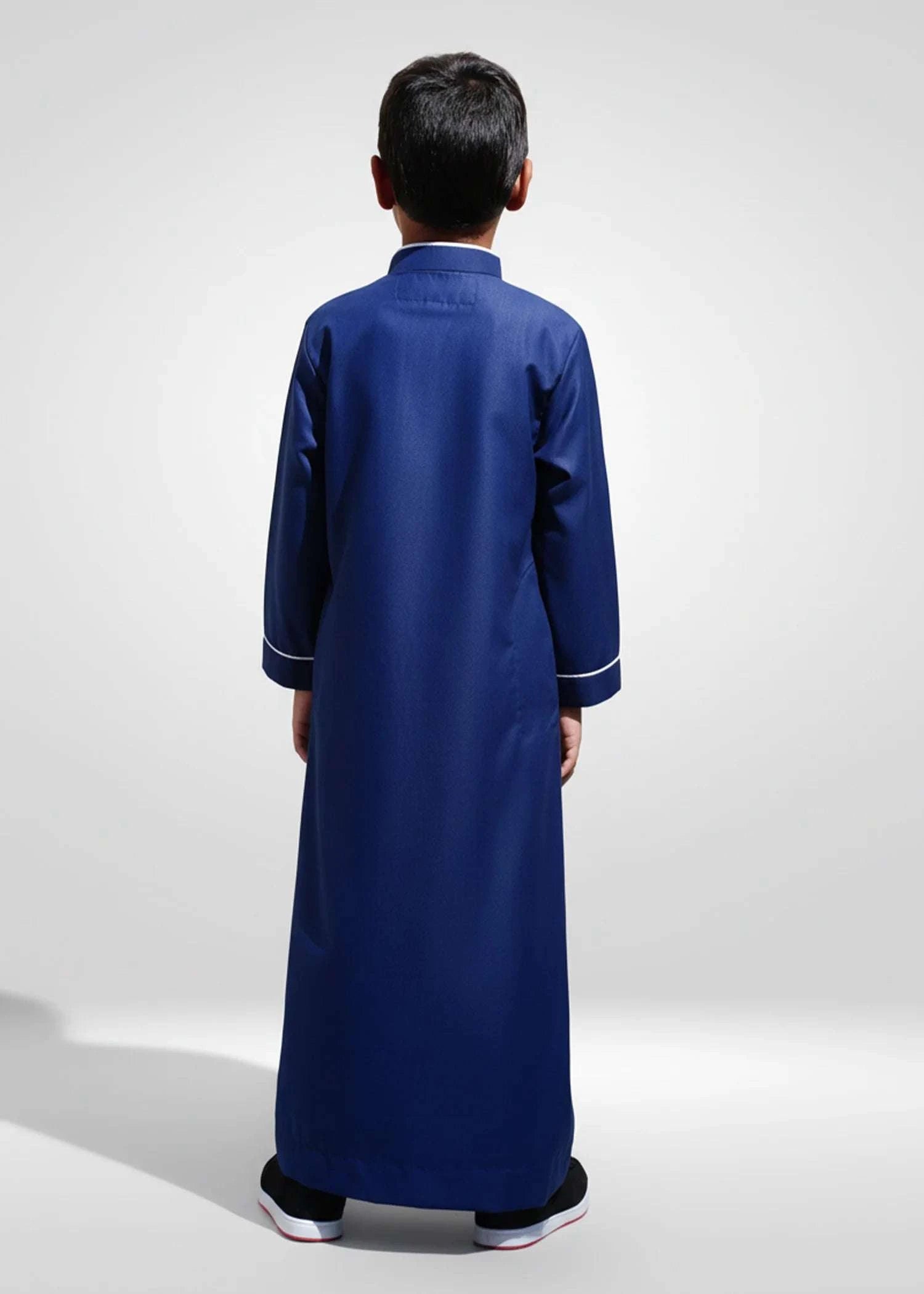 Navy blue embroidered thobe with white geometric detail for boys, back view