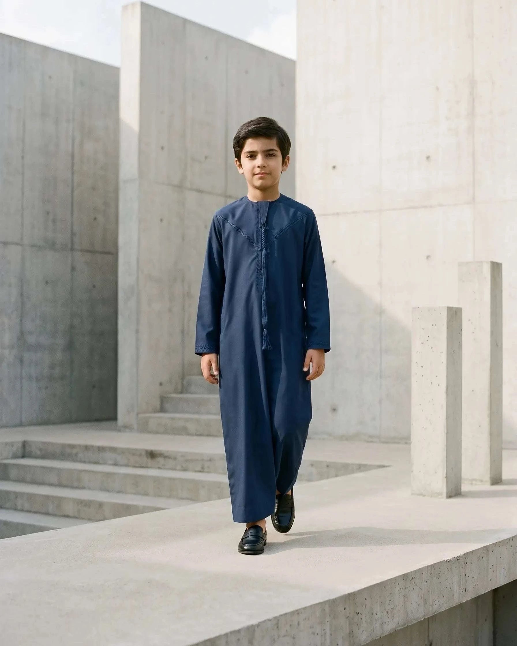 Navy blue Emirati thobe with braided tarboush for boys, full front view