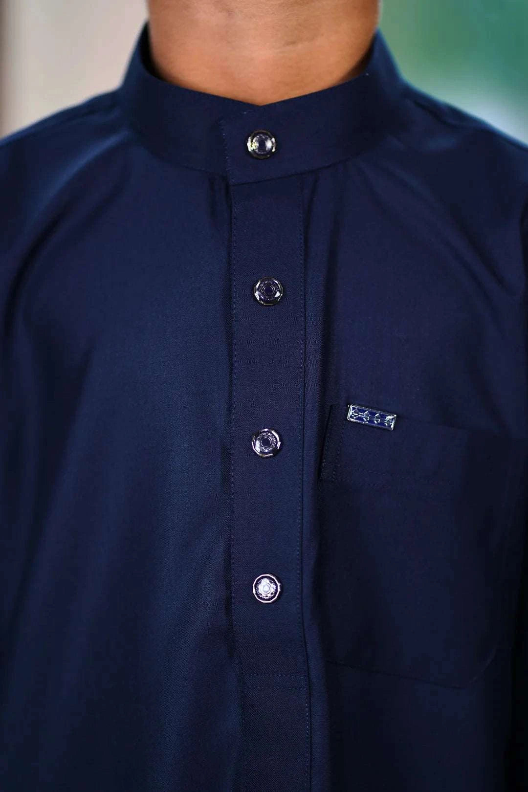 Navy blue thobe for boys, close-up of the collar and buttons