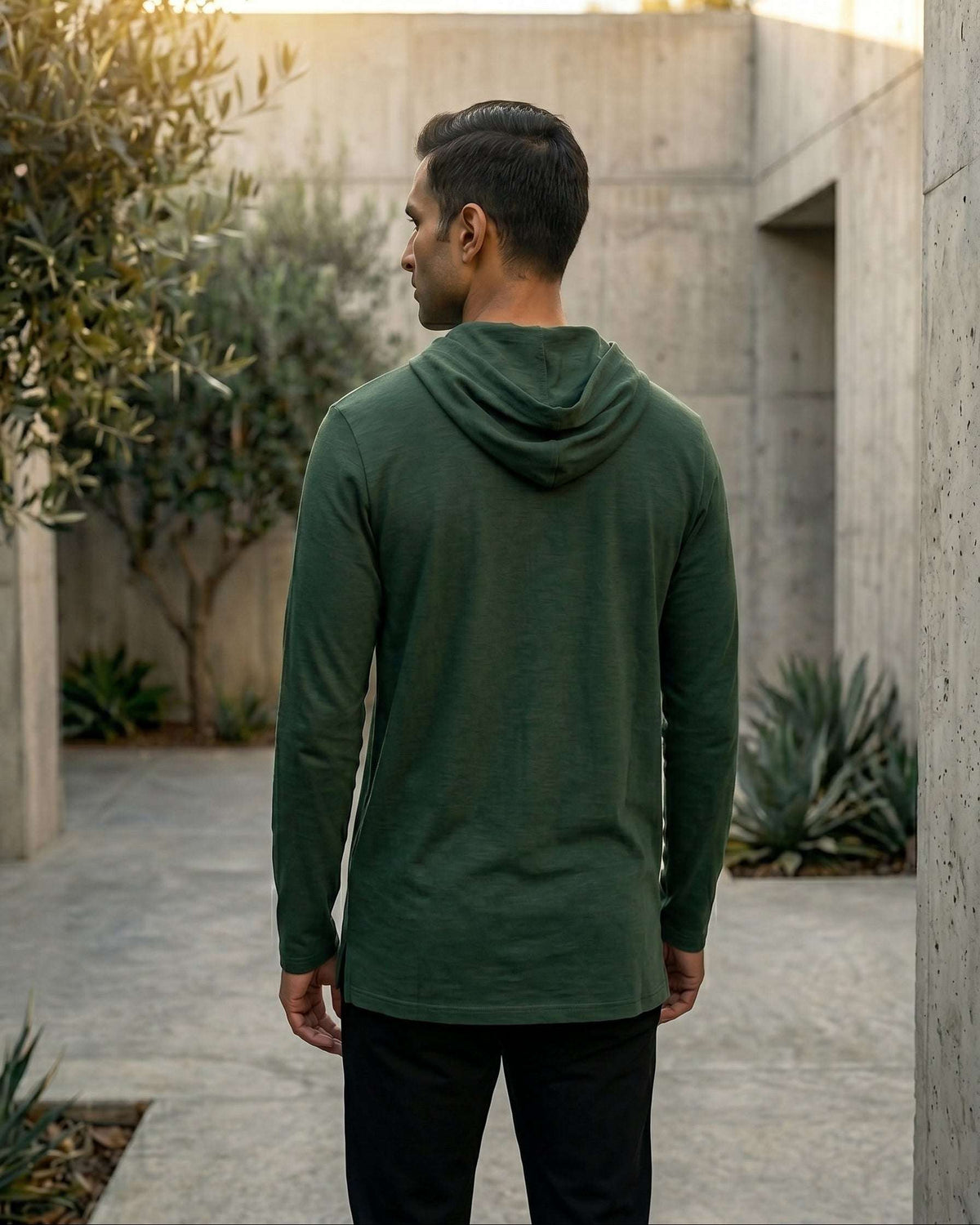 Olive green hooded kurta with half-zip jersey for men, styled on a model outdoors