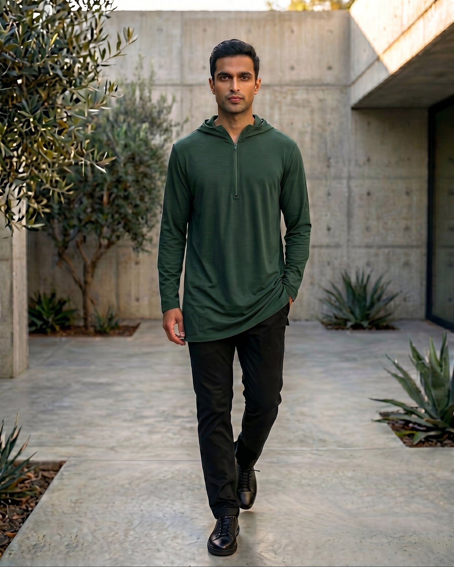 Premium olive green jersey hooded kurta for men back view showing hood detail, half zip Islamic streetwear, modest casual menswear.