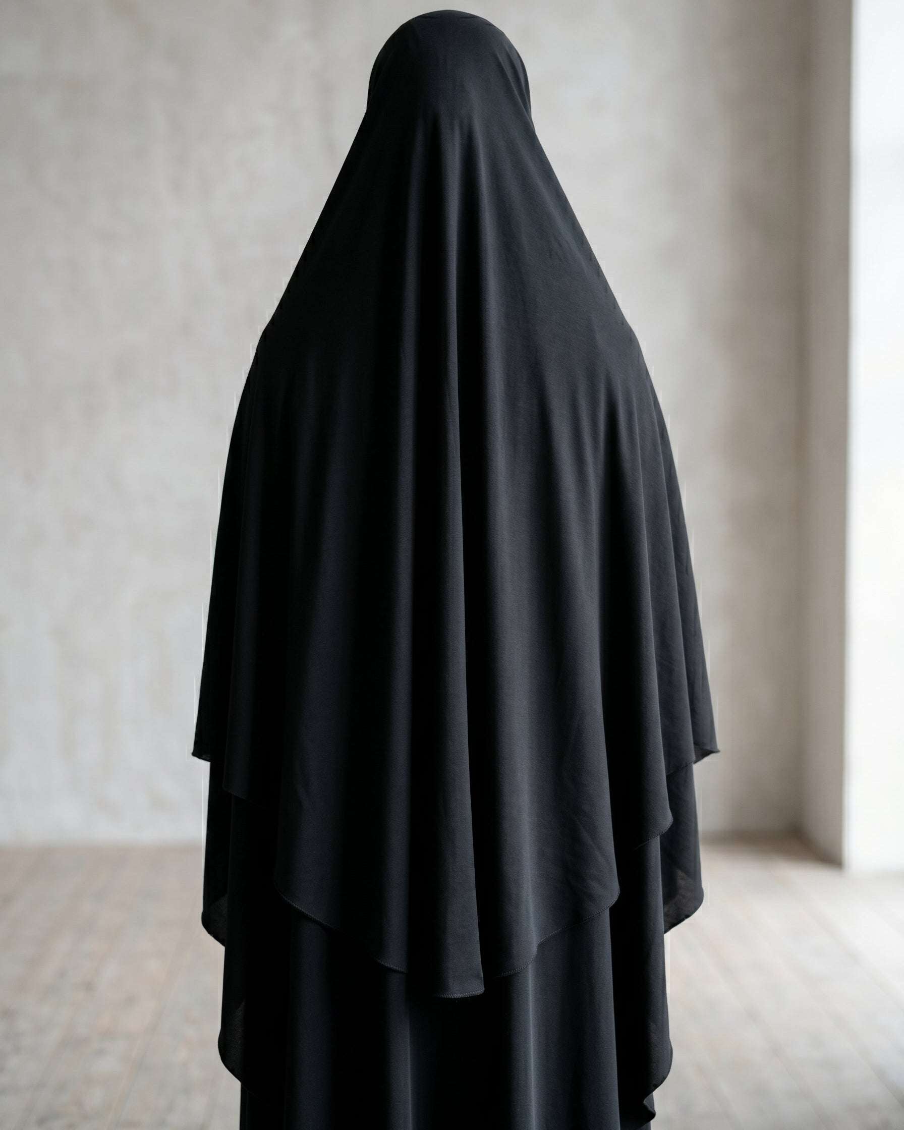 Black slip-on khimar with instant hijab for women, back view