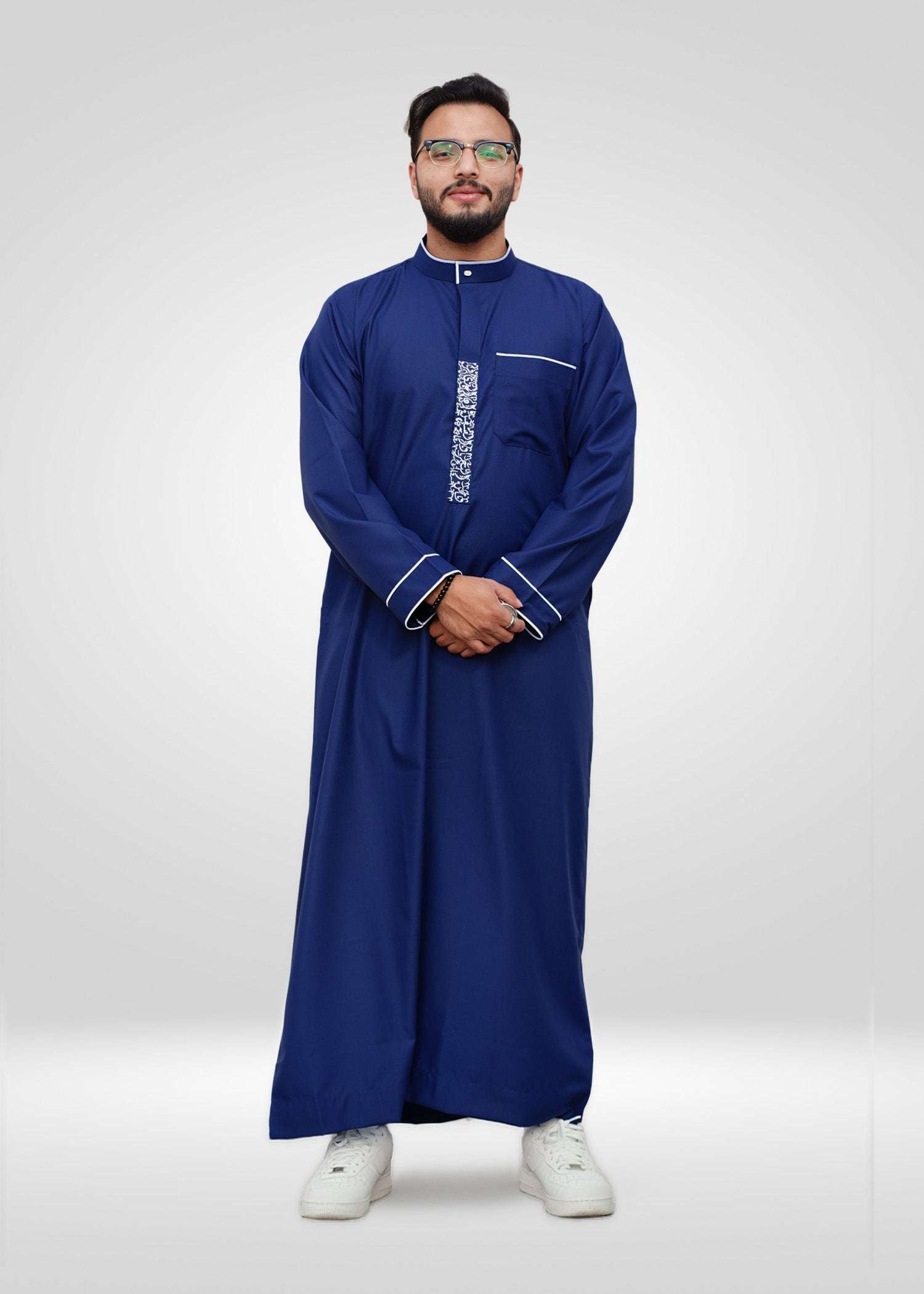 Royal blue and white embroidered thobe with mandarin collar for men, full front view