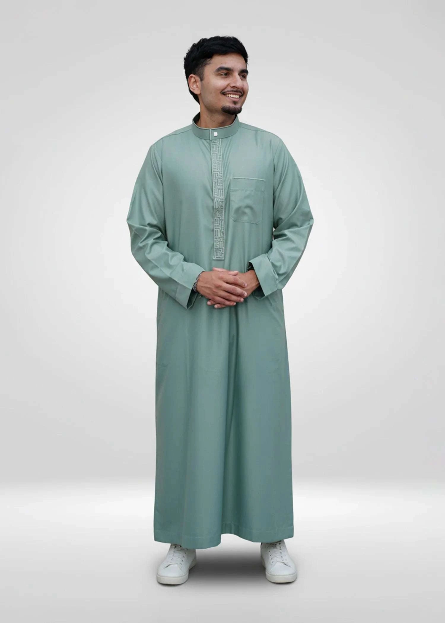 Sage green embroidered thobe with mandarin collar for men, close-up of the fabric