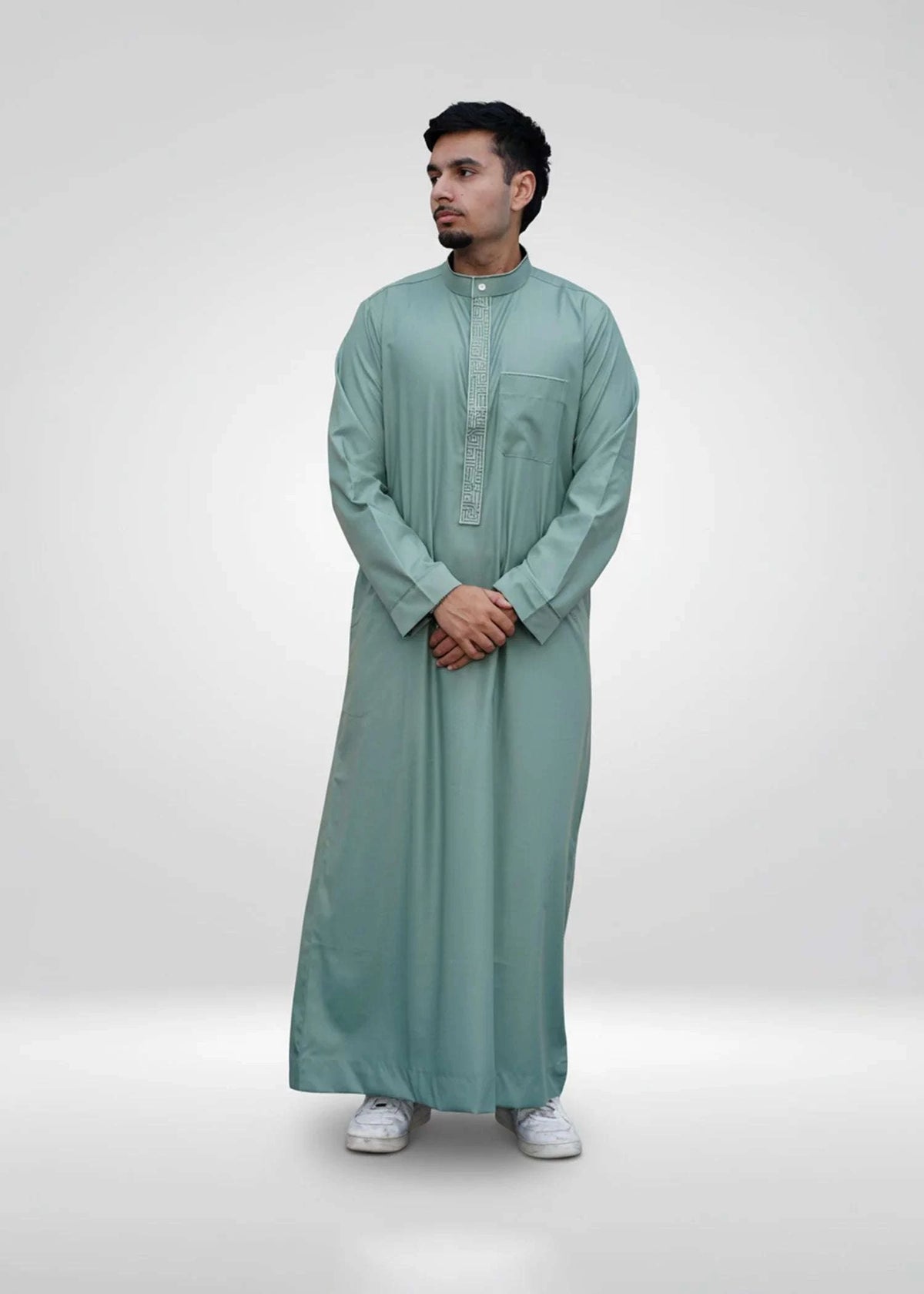 Sage green embroidered thobe with mandarin collar for men, stitched pattern in close detail