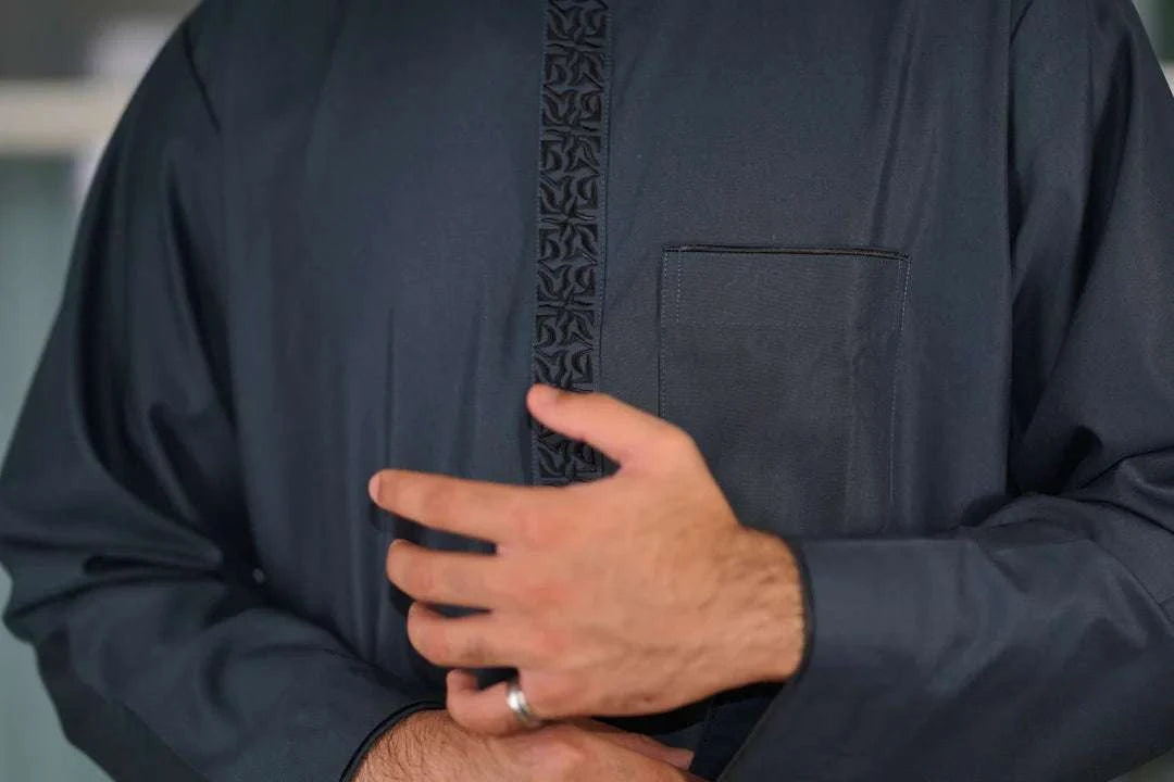 Slate blue embroidered thobe with mandarin collar for men, embroidery shown in close detail