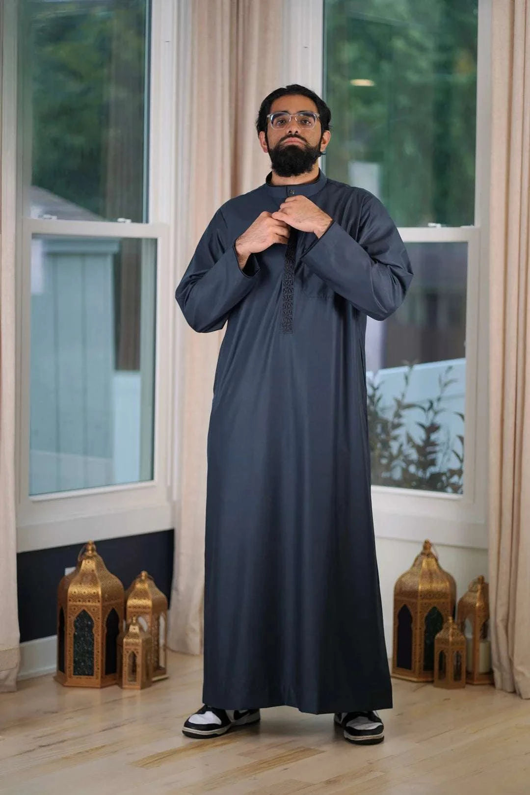 Slate blue embroidered thobe with mandarin collar for men, side profile view