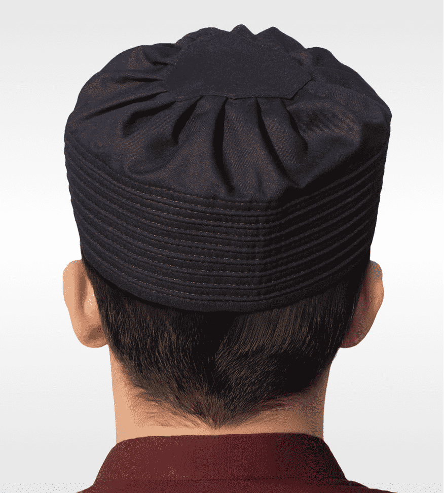 Black pleated gathered kufi prayer cap for men, close-up of the stitched crown