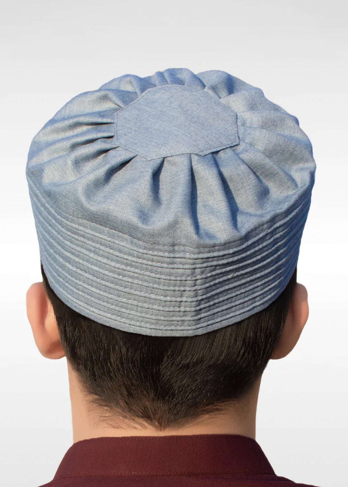 Blue pleated gathered kufi prayer cap for men, shown from the front